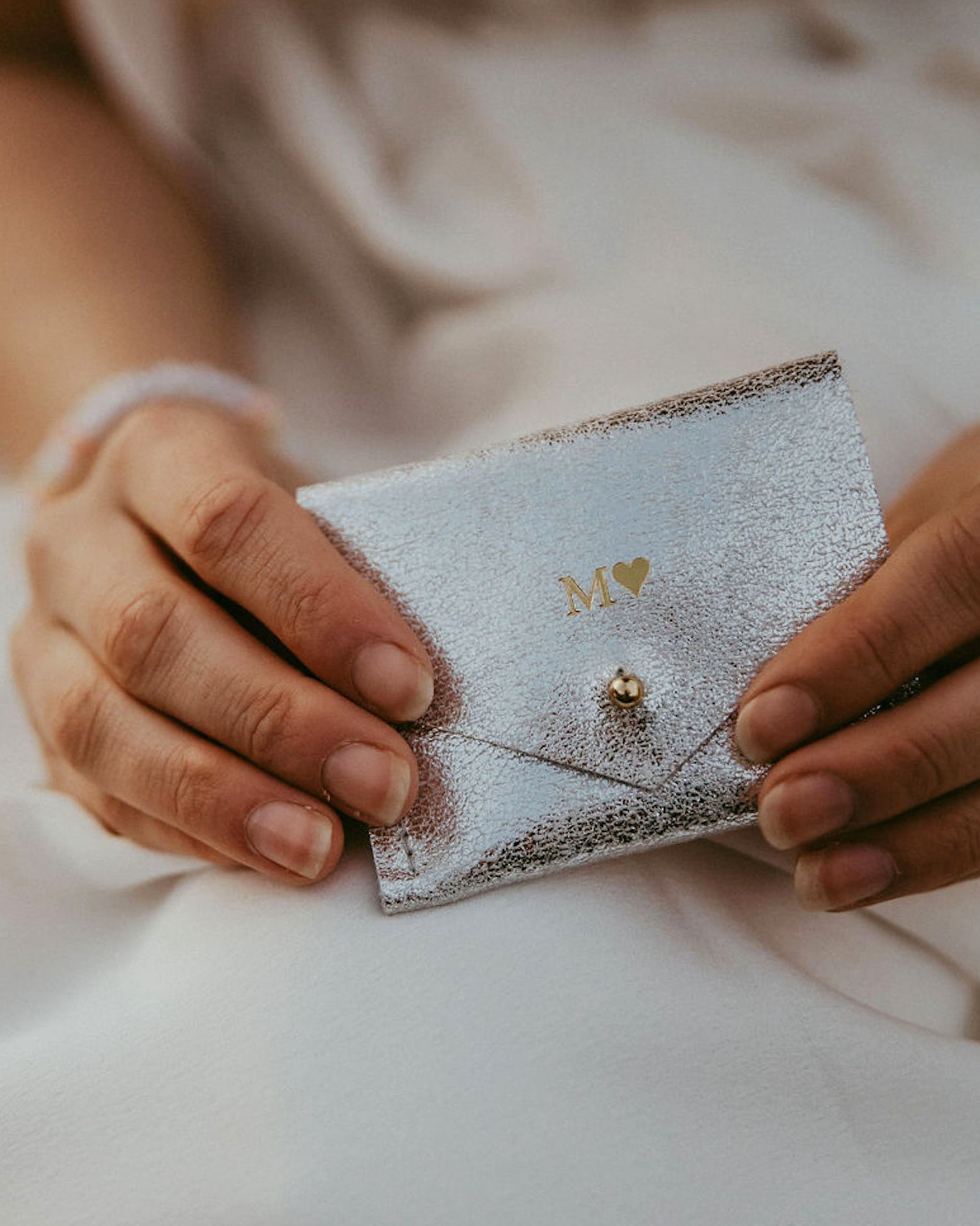 Personalised silver jewellery pouch, with brides initials and a heart monogrammed on the front.
