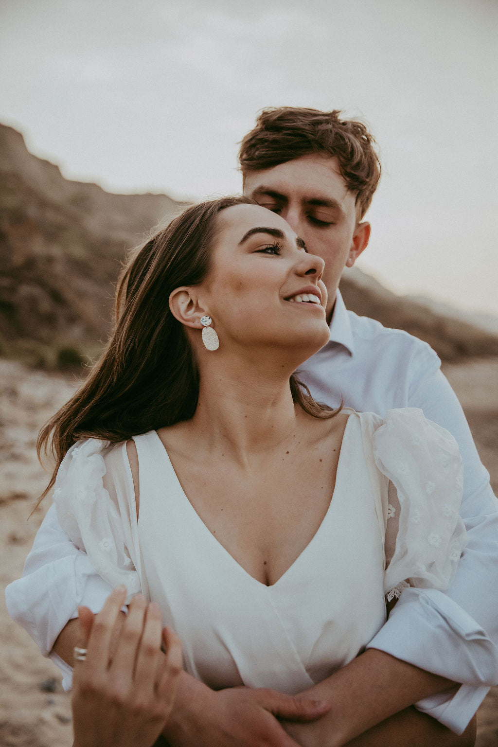 Bride and Groom on a beach on their wedding day.