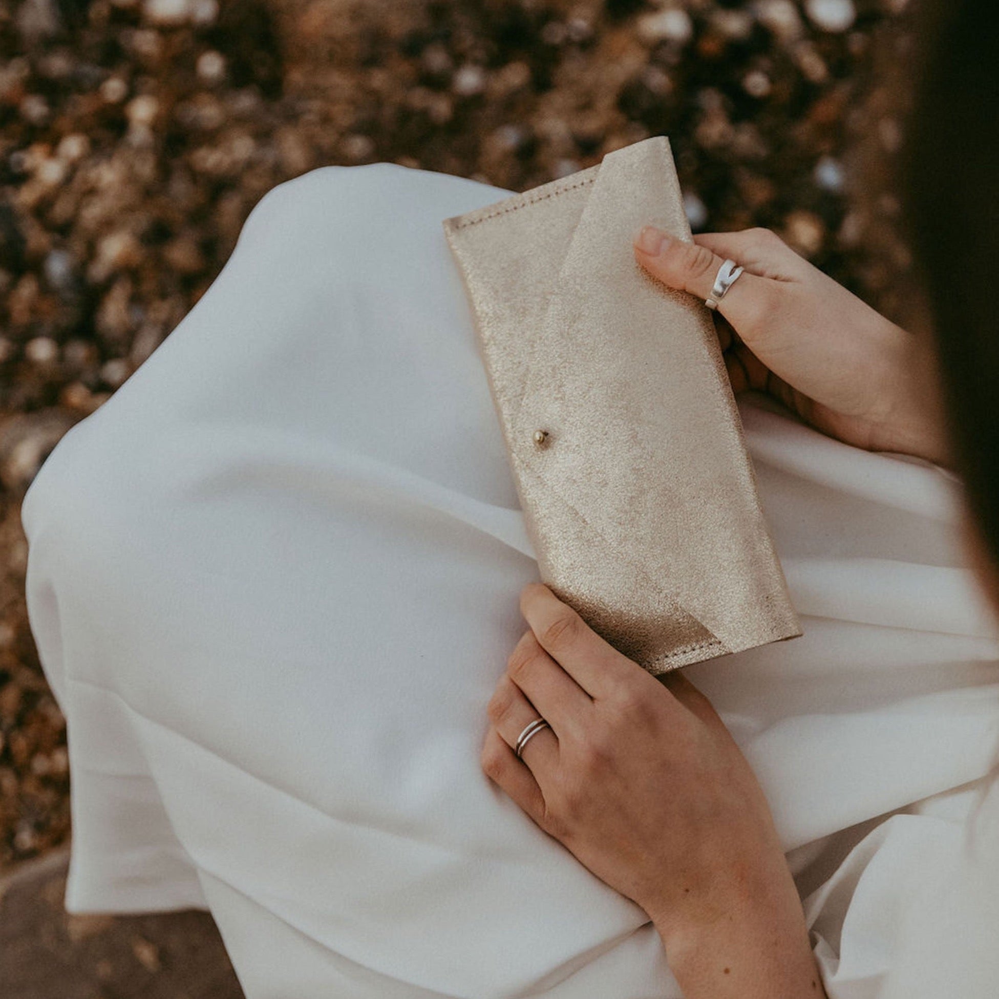 Leather clutch purse in shimmer gold.