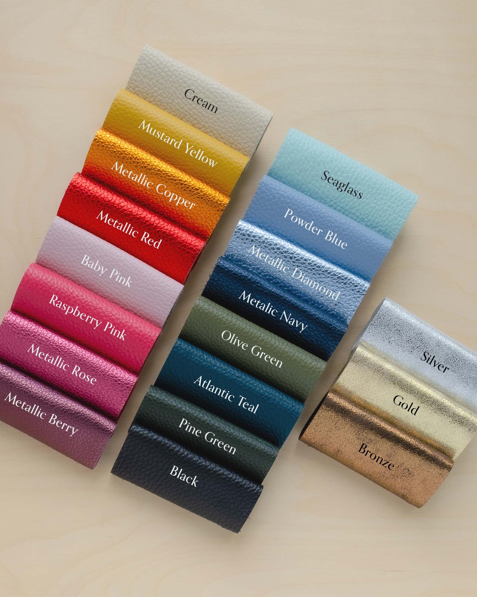 Colourful leather swatches on a plywood board