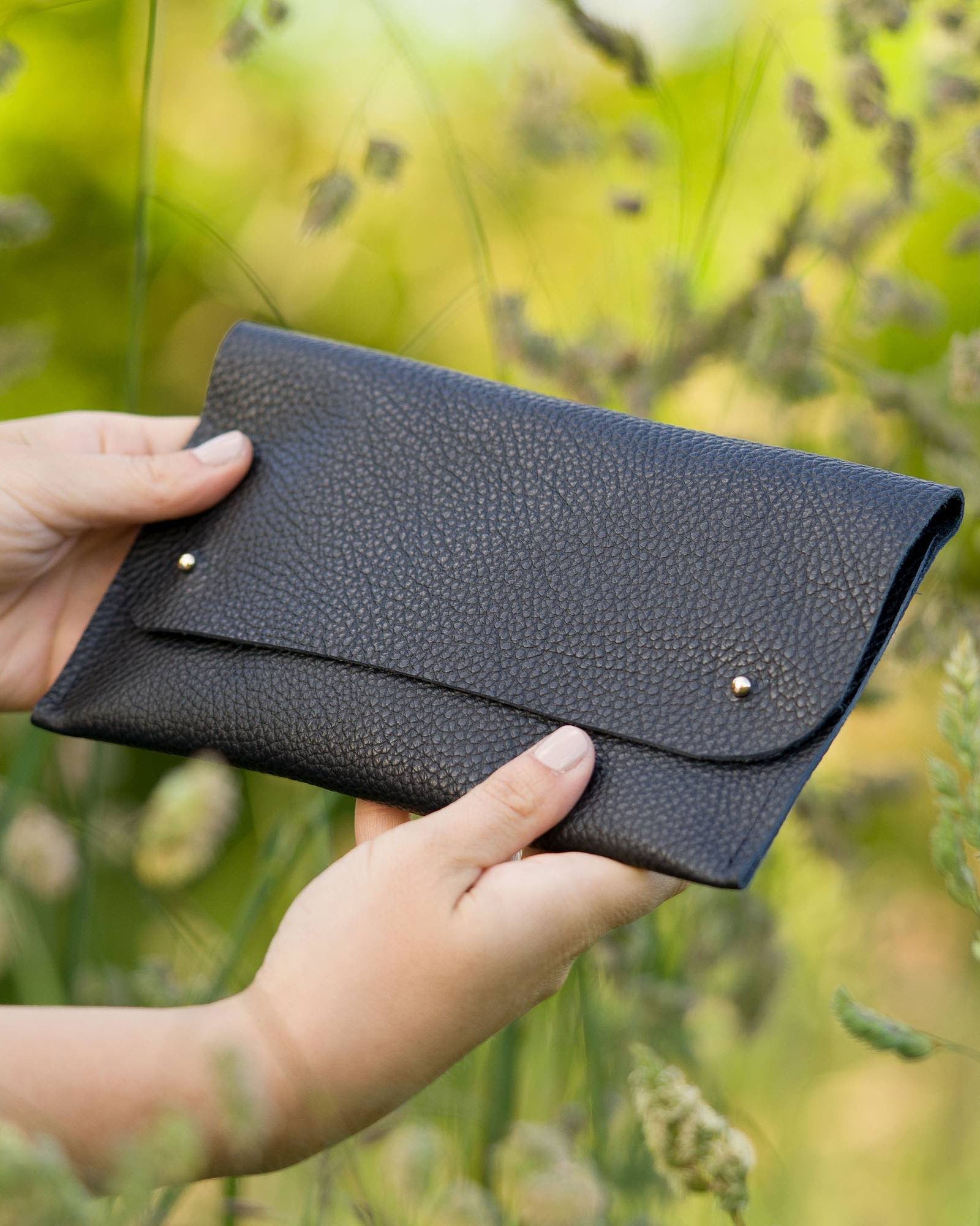 Black leather clutch bag
