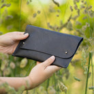 Black leather clutch bag