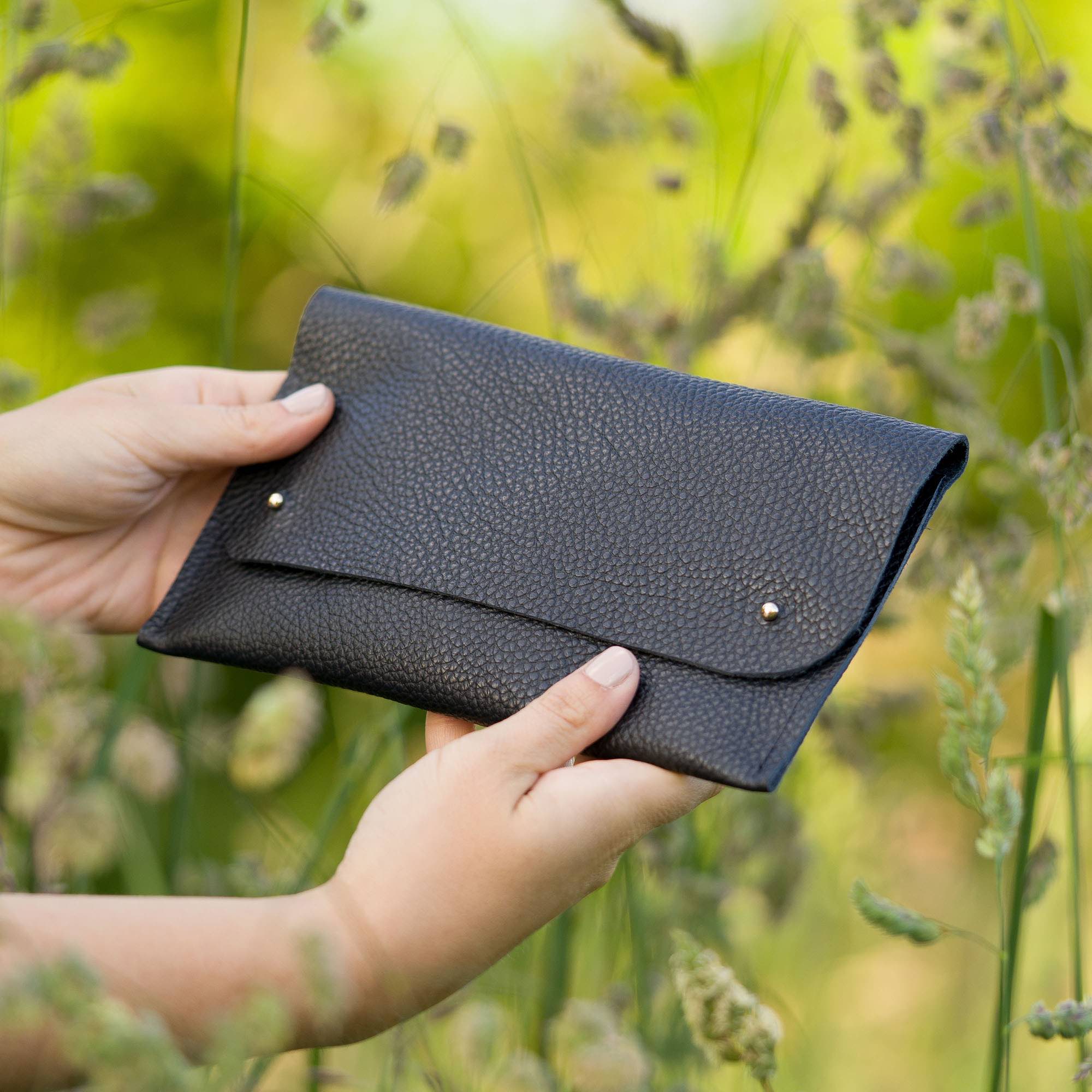 Black leather clutch bag
