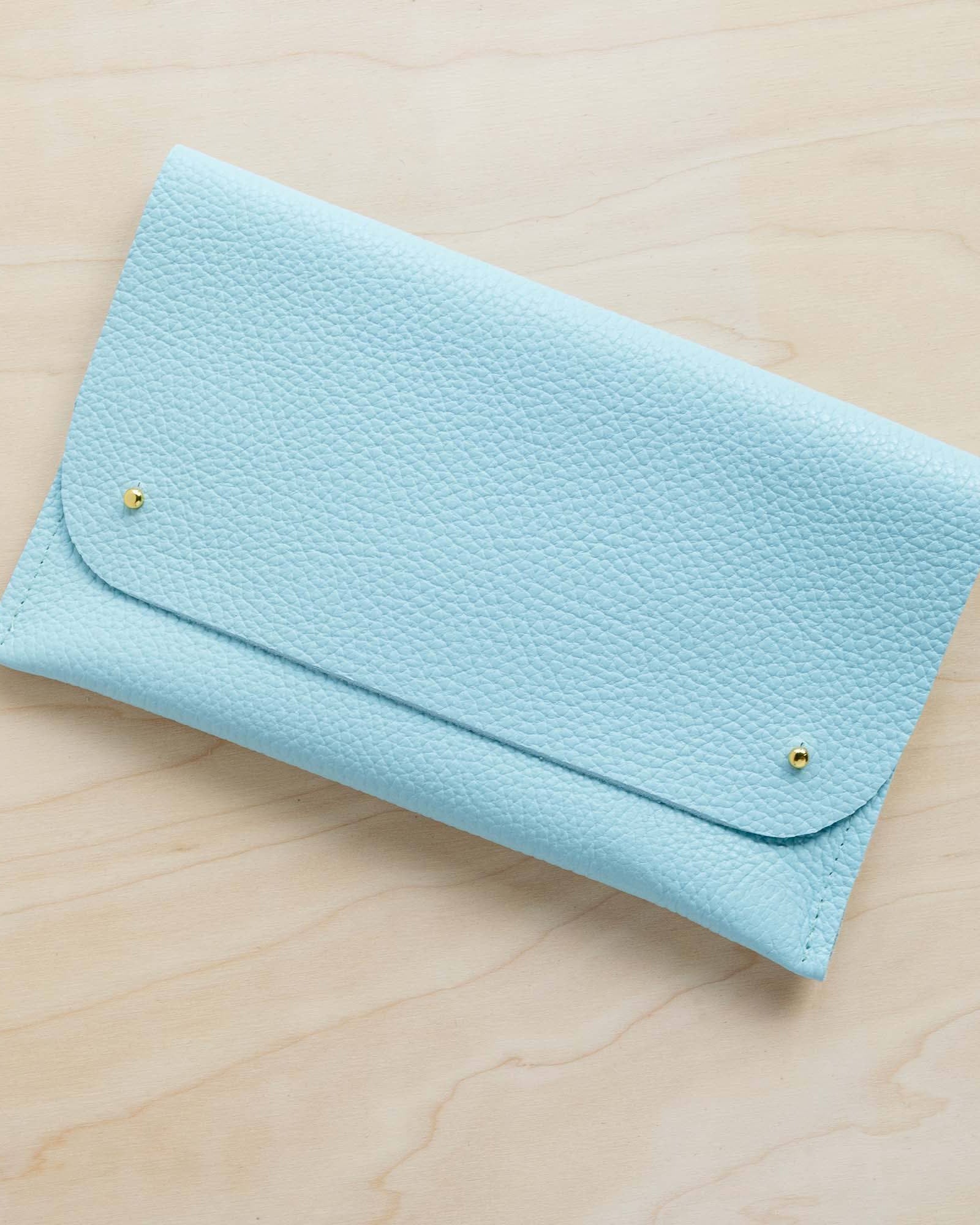 Leather clutch bag in powder blue colour