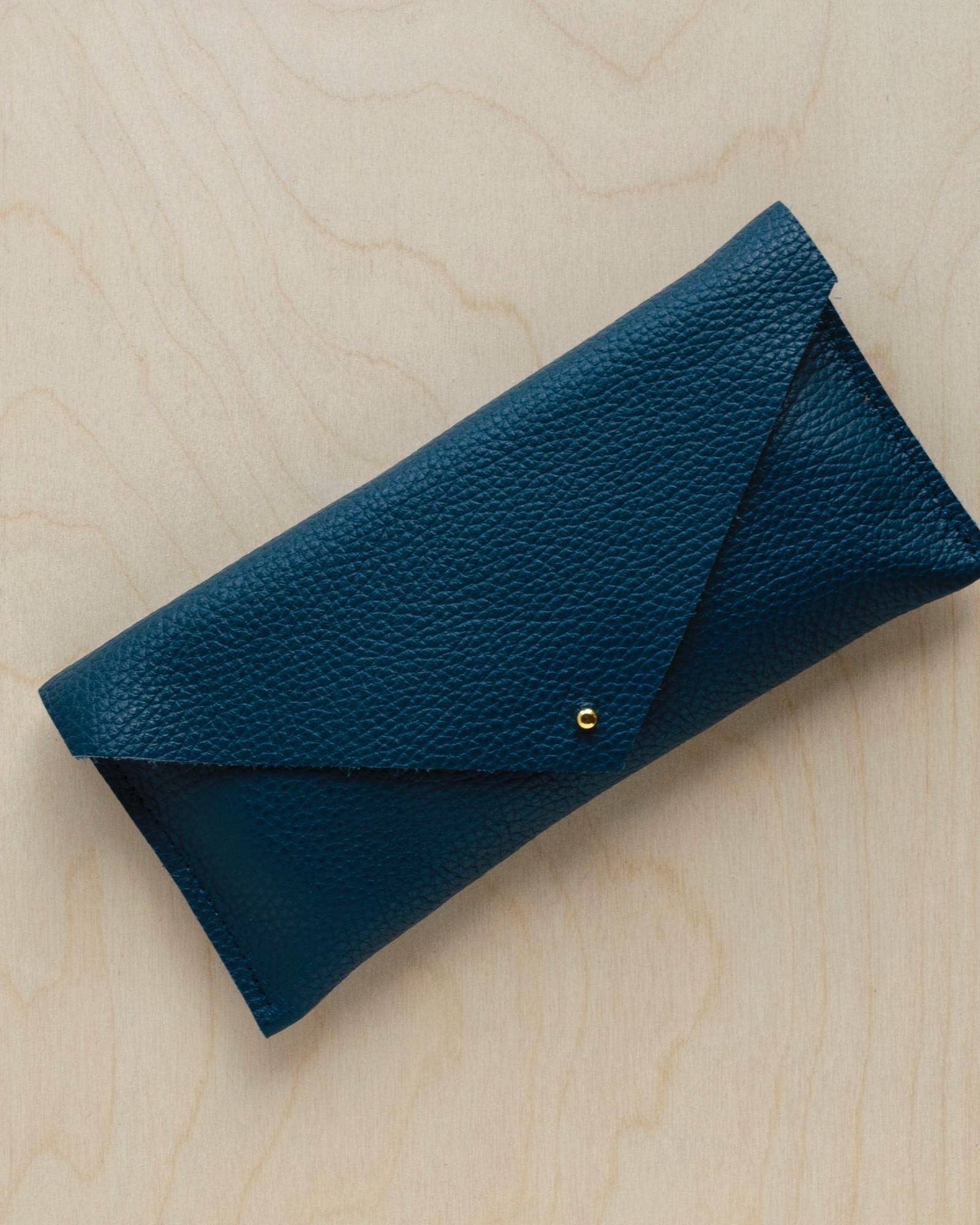 Leather clutch purse in Atlantic Teal Green.