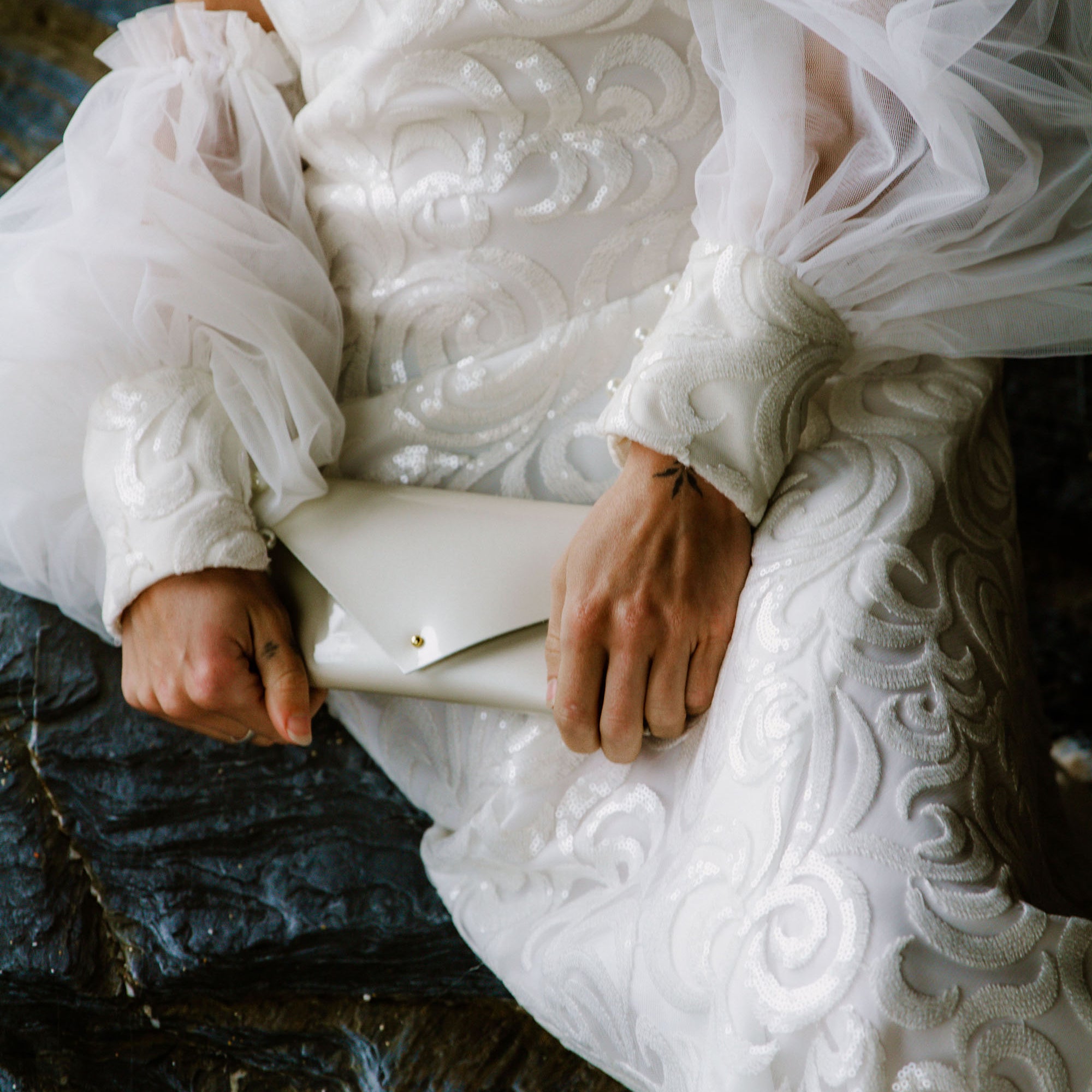 Pearlescent Ivory White Bridal Clutch Bag made with patent leather in a simple, minimalist envelope design.