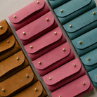 lots of sewing needle cases on the table