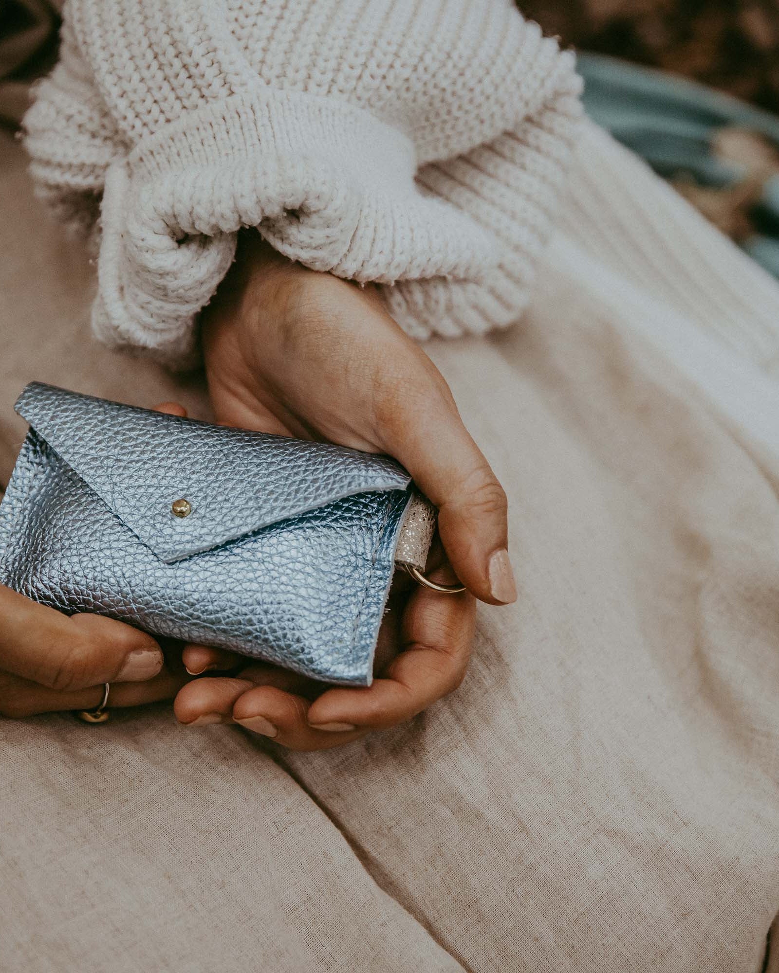 Model holding the Metallic Diamond leather keyring card holder.