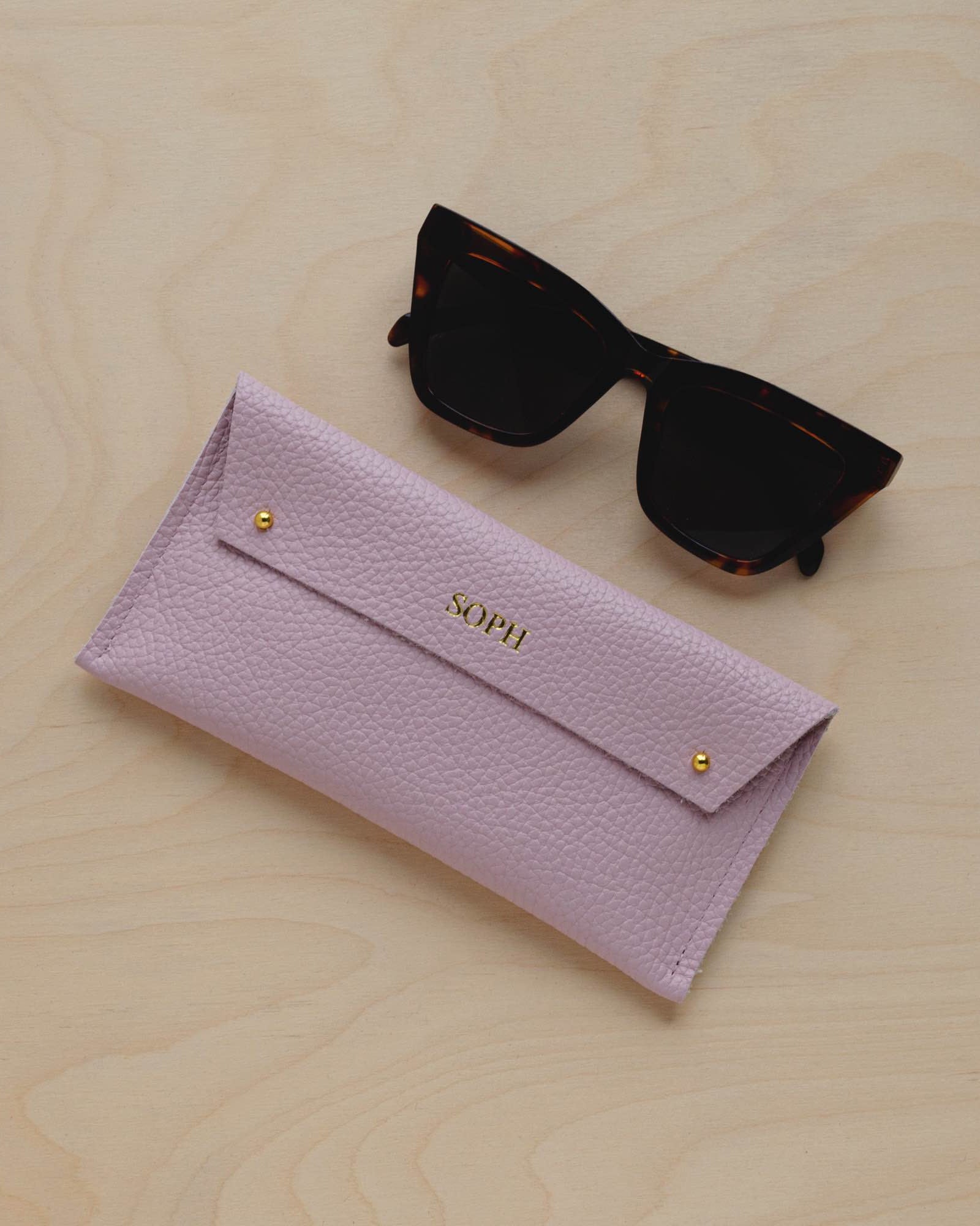 Personalised Leather Double stud glasses case in baby pink with sunglasses.