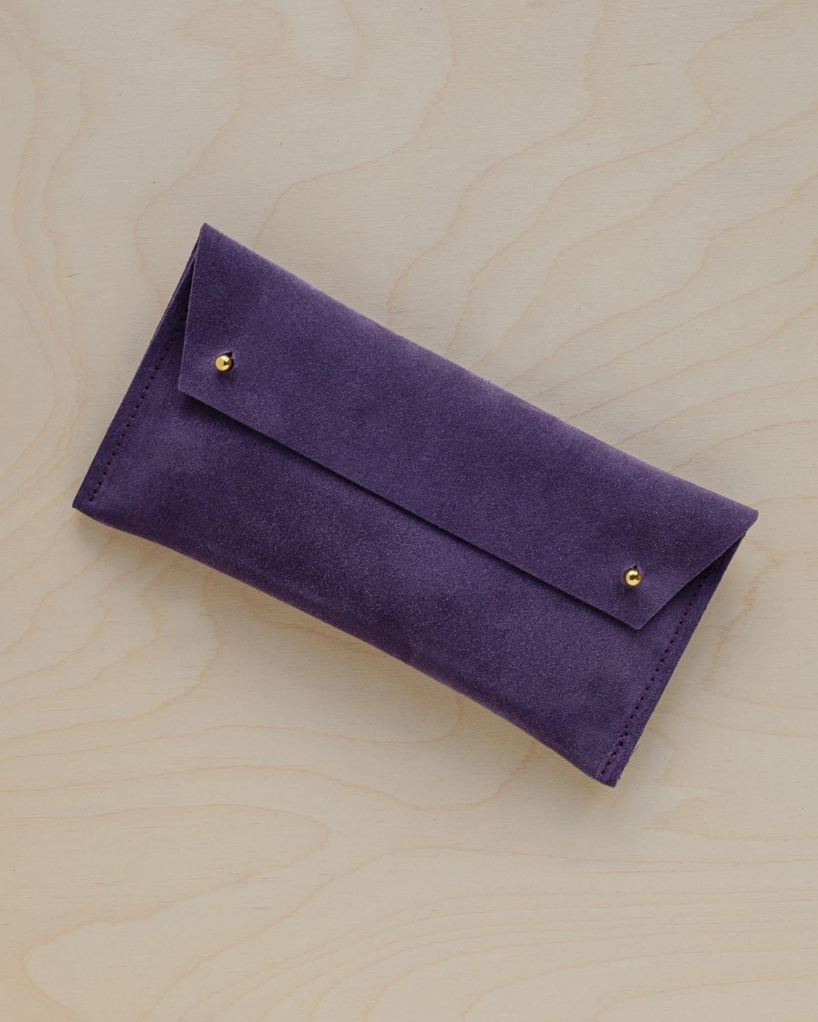 The suede pen case in Grape Purple. Featuring a double stud.