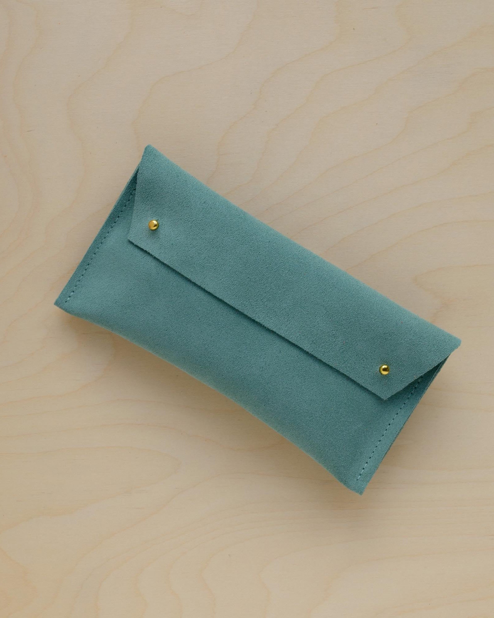 The suede pen case in Mint Green. Featuring a double stud.
