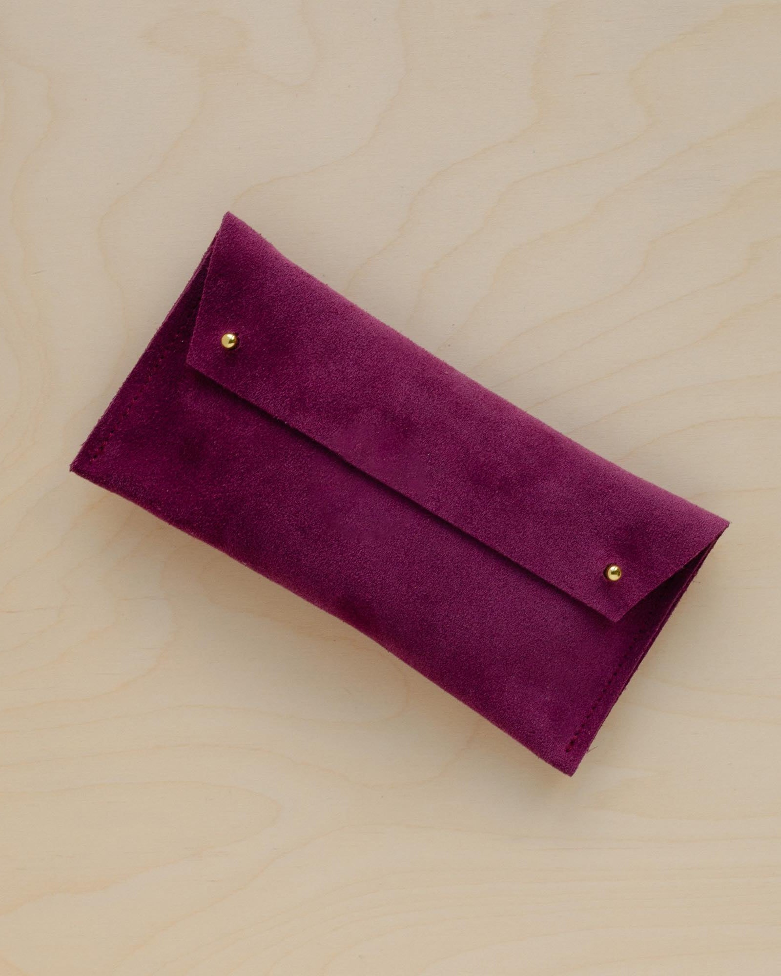 The suede pen case in Plum Purple. Featuring a double stud.