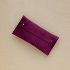 The suede pen case in Plum Purple. Featuring a double stud.
