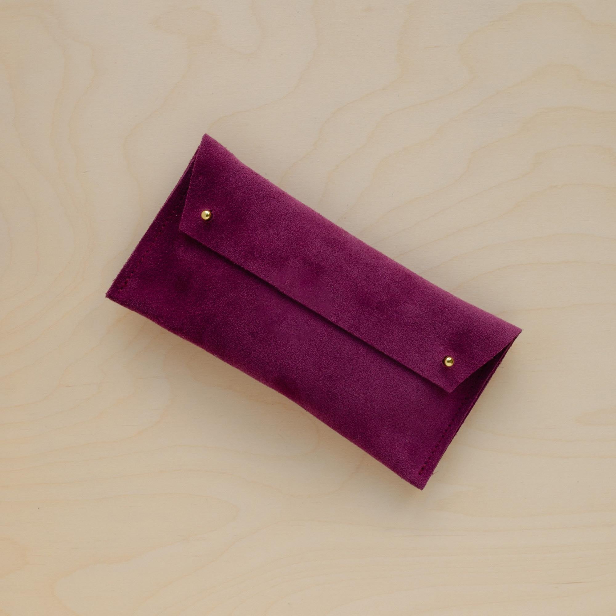 The suede pen case in Plum Purple. Featuring a double stud.