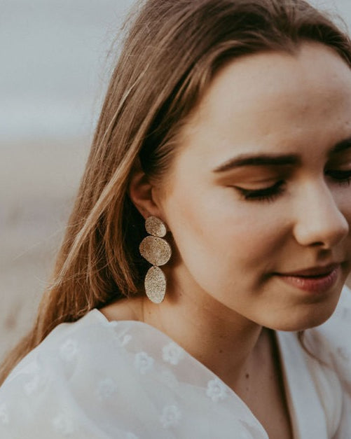 Kensa Gold Leather Earrings worn by boho bride.