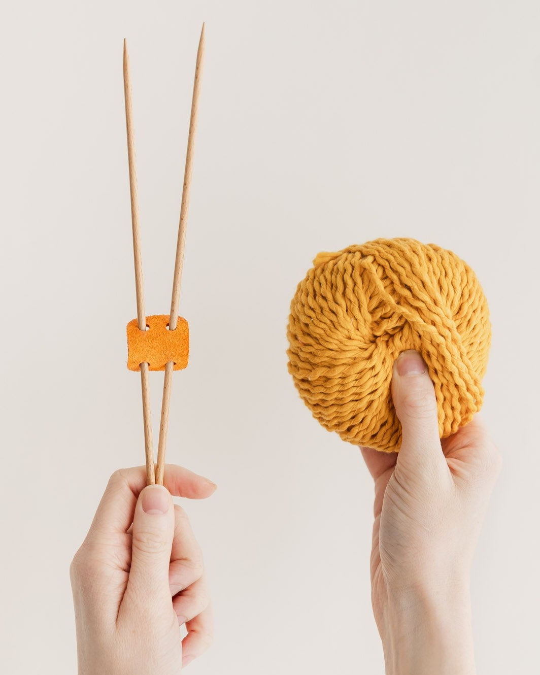 Orange suede knitting needle holder
