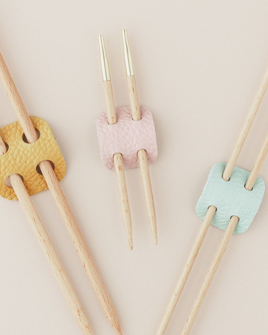Leather knitting needle holder in yellow, pink and blue