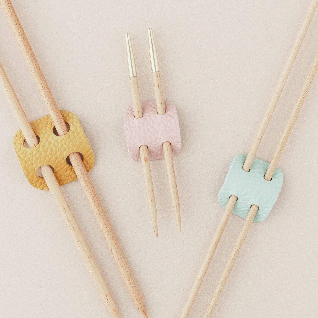 Leather knitting needle holder in yellow, pink and blue