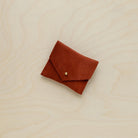 A suede Stitch Markers pouch in Chestnut brown. Complete with a stud for secure closing.