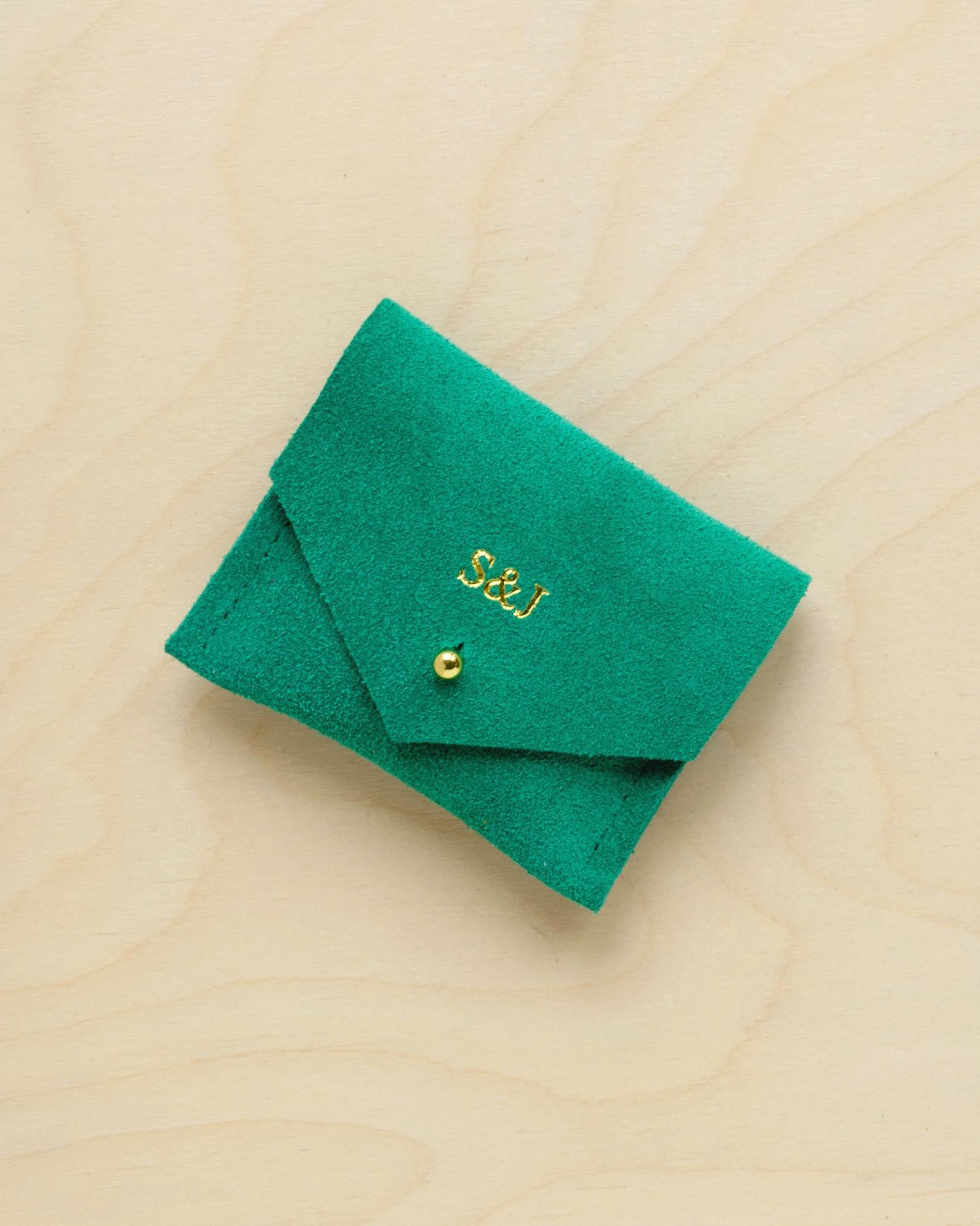 A suede Stitch Markers pouch in Jade Green. Complete with a stud for secure closing. This pouch has been personalised with couple initials.