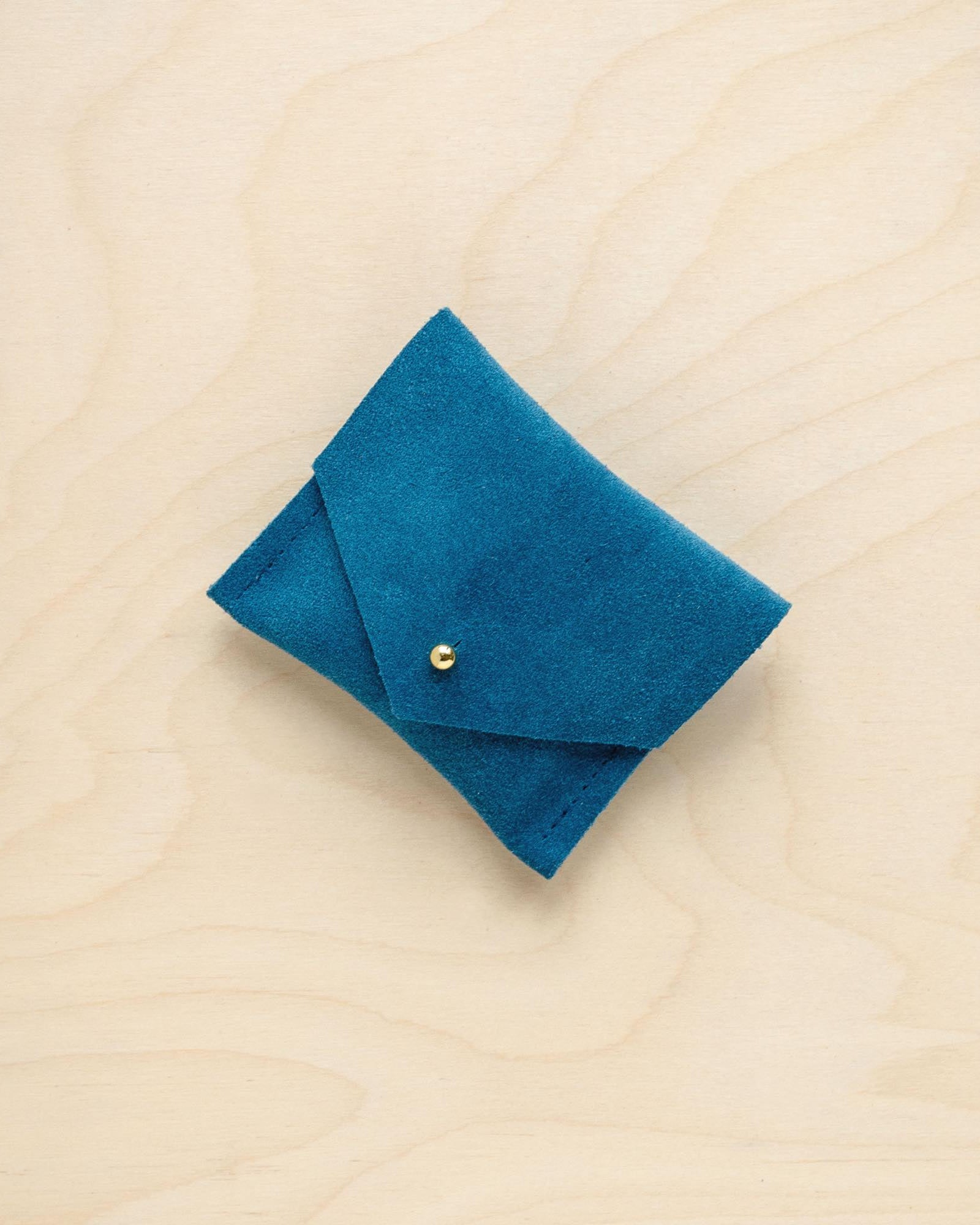A suede Stitch Markers pouch in Teal Green. Complete with a stud for secure closing.