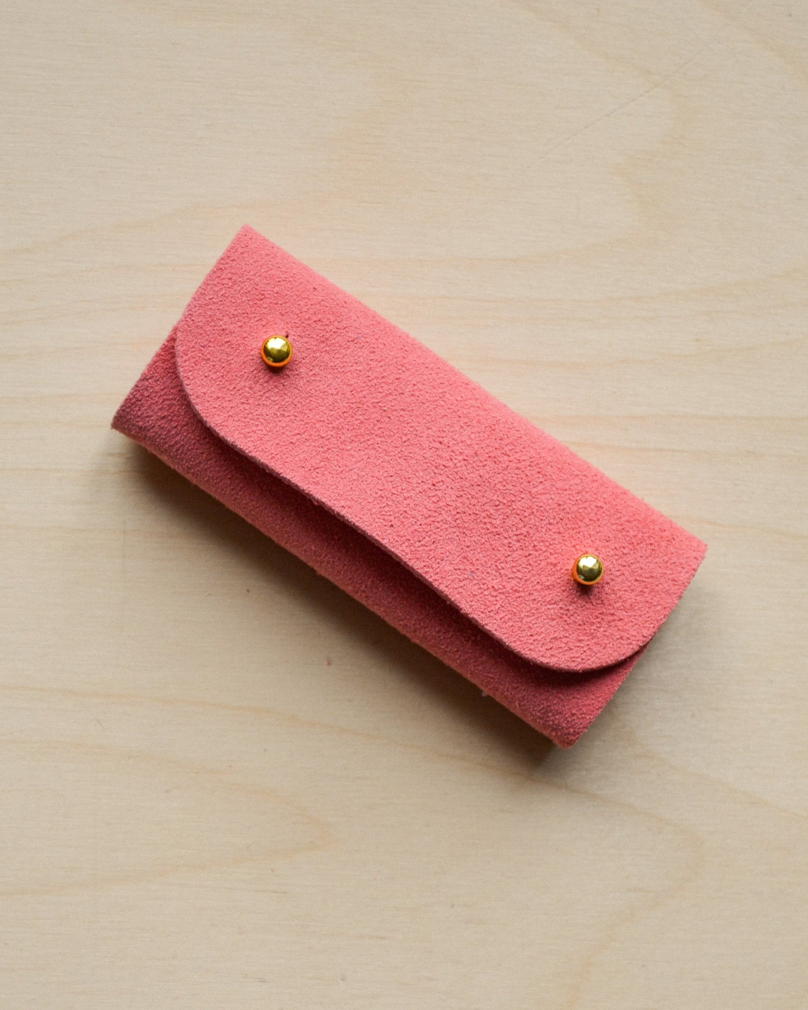 Coral Pink sewing needle case.