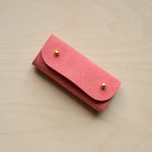 Coral Pink sewing needle case.