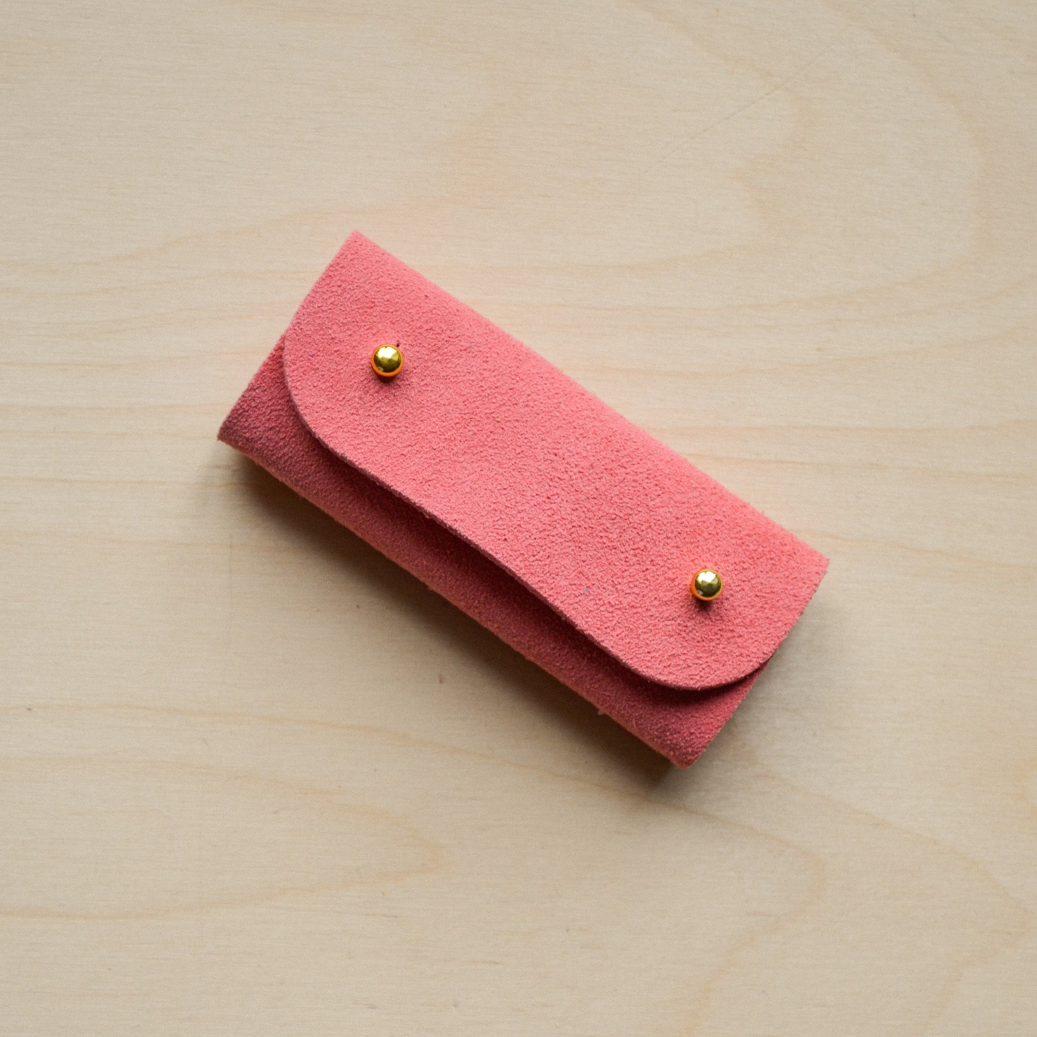 Coral Pink sewing needle case.