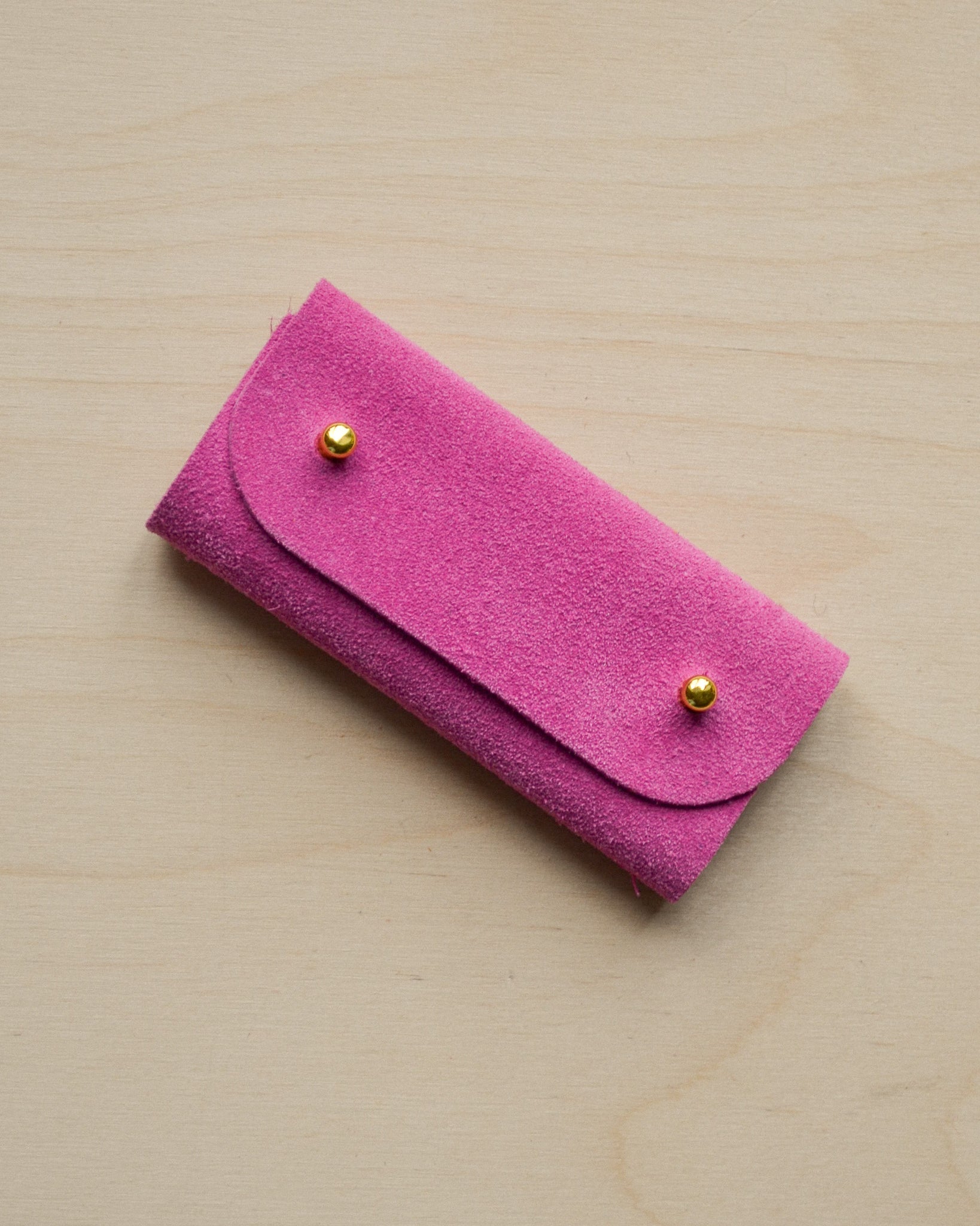 Fuchsia pink sewing needle case.