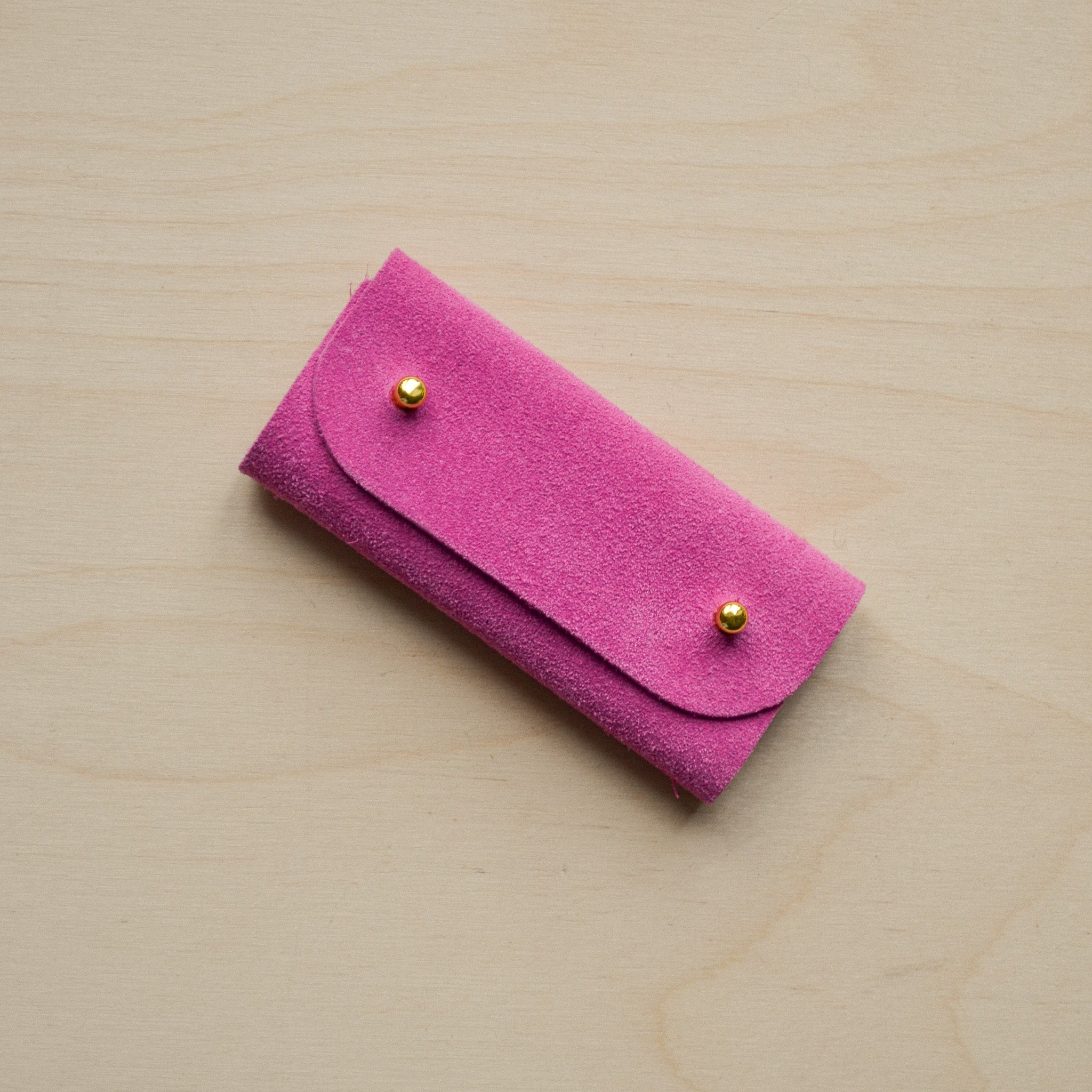Fuchsia pink sewing needle case.
