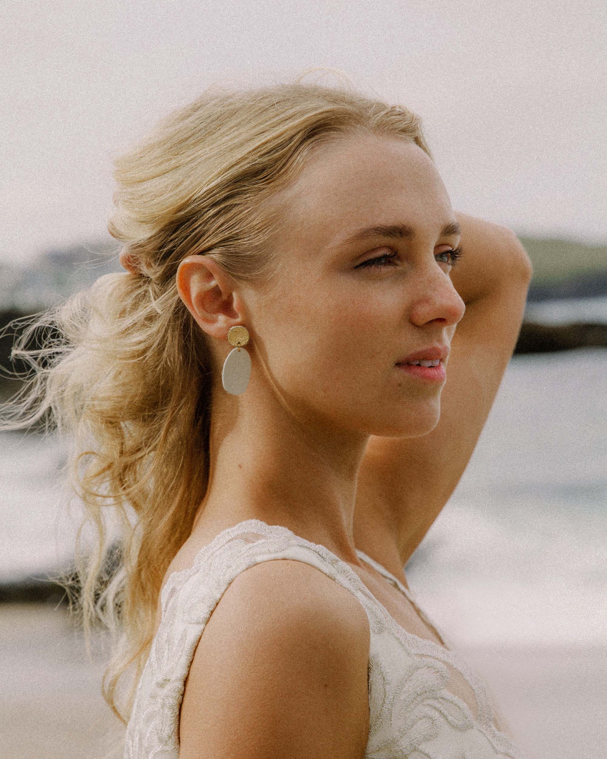 Maia Leather Earrings worn by bride on a beach.