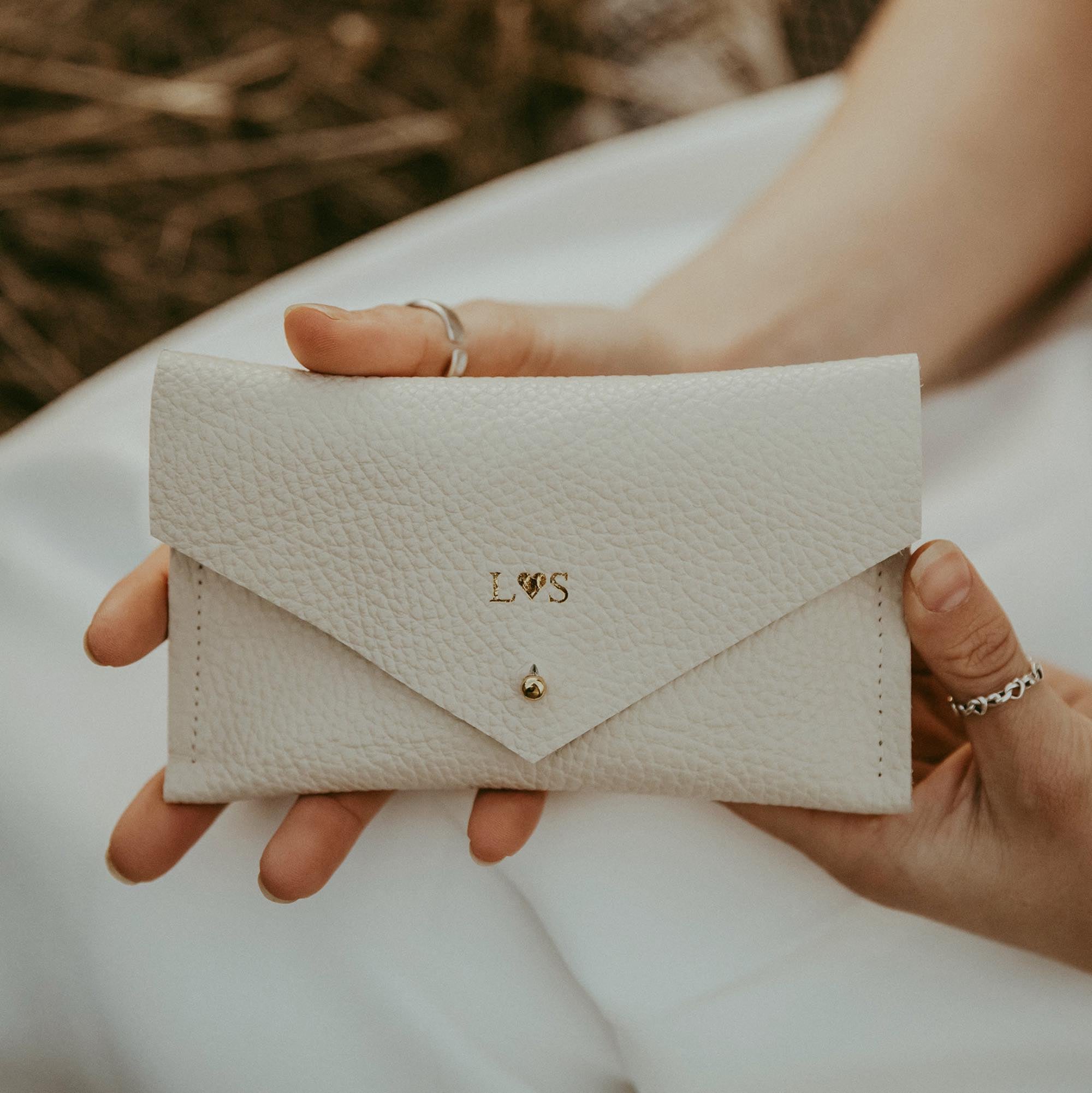 Cream Leather passport pouch that has been personalised