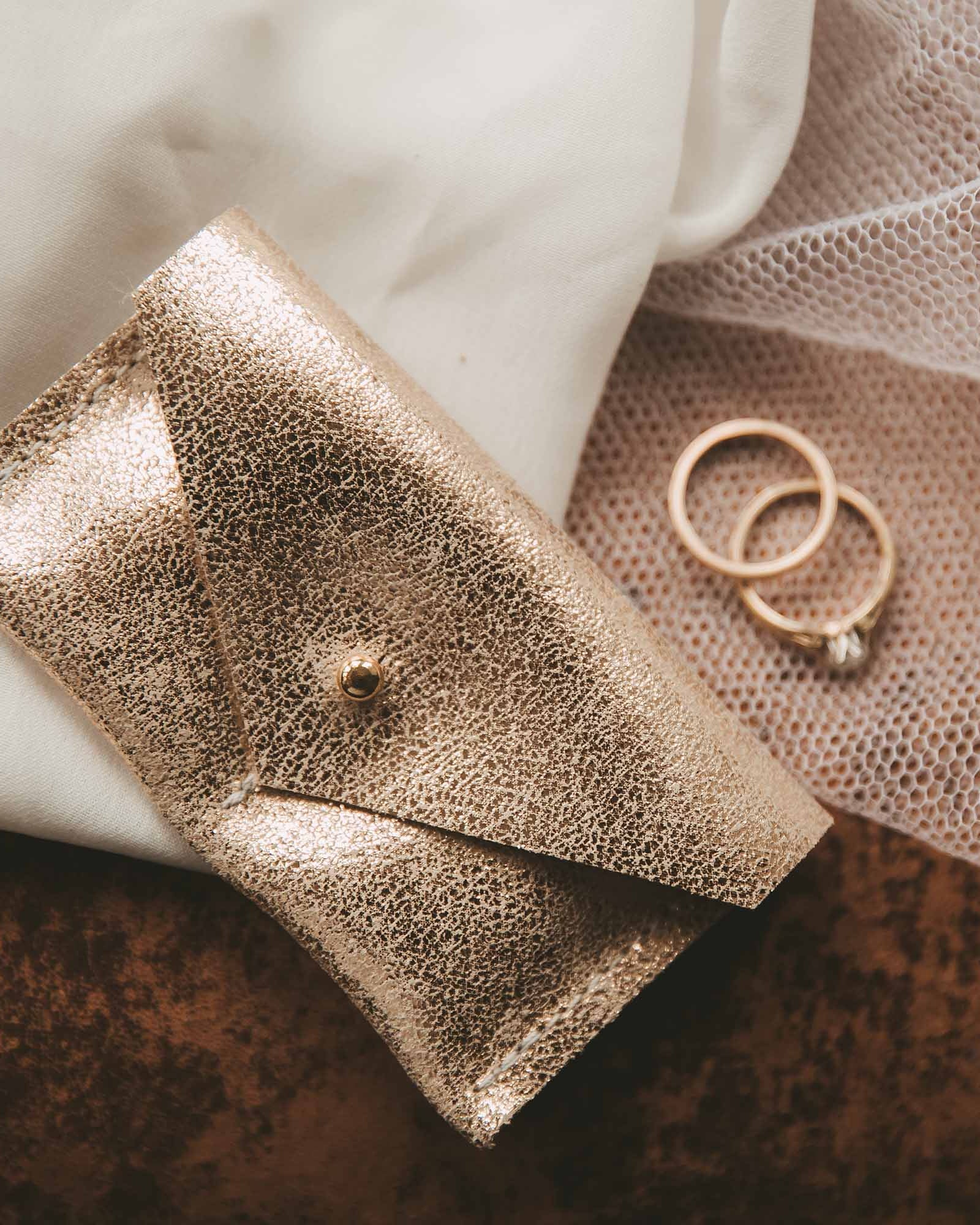 Couples ring pouch in shimmer gold leather.