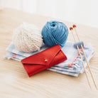 Metallic red sewing needle case