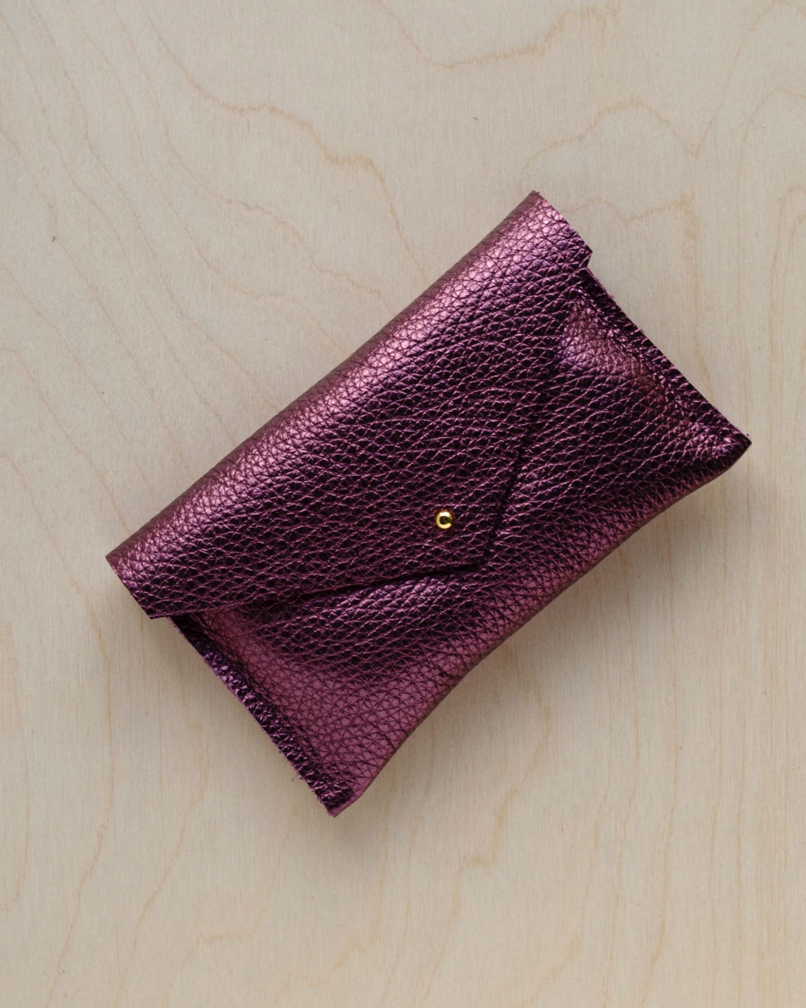Leather everyday purse in metallic berry.