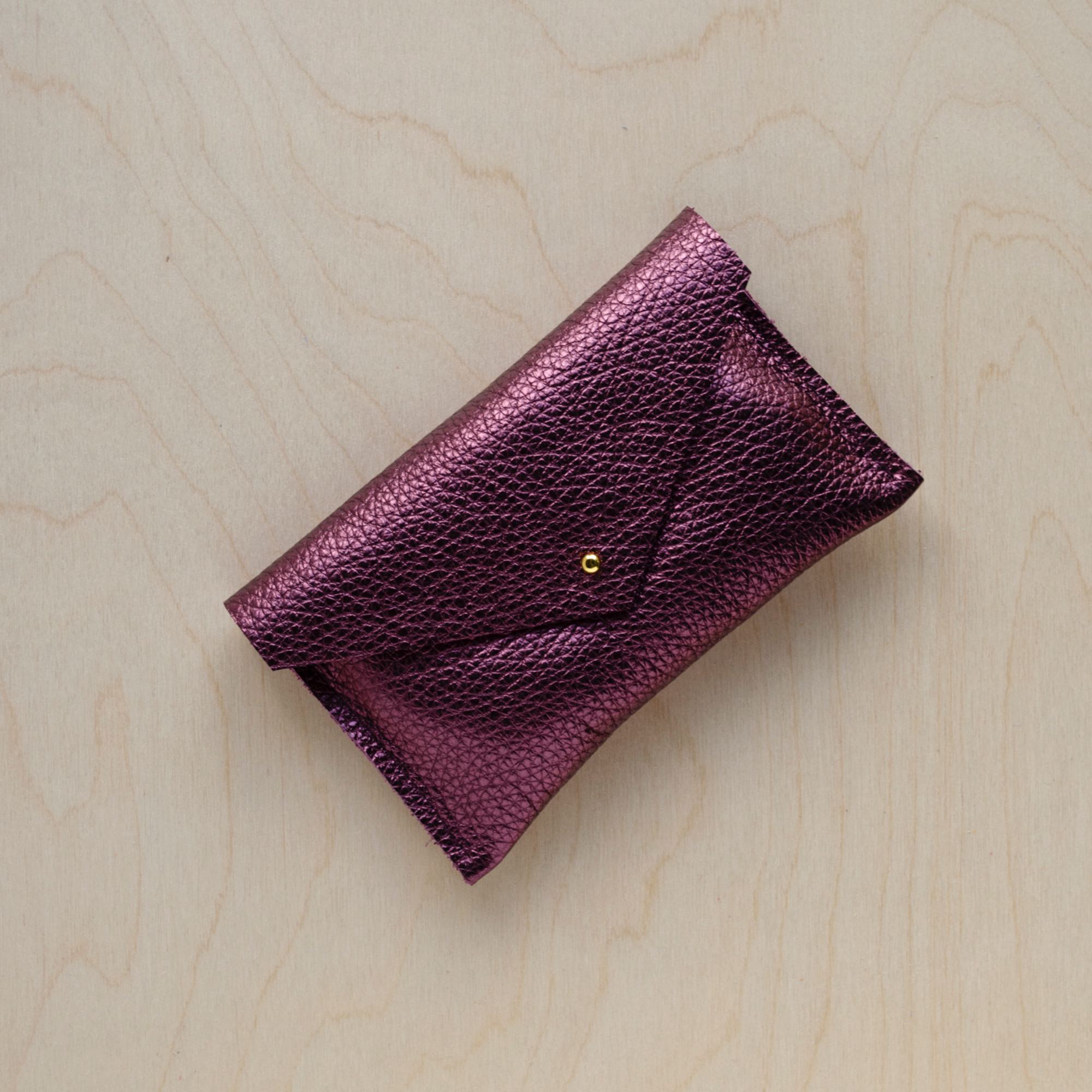 Leather everyday purse in metallic berry.