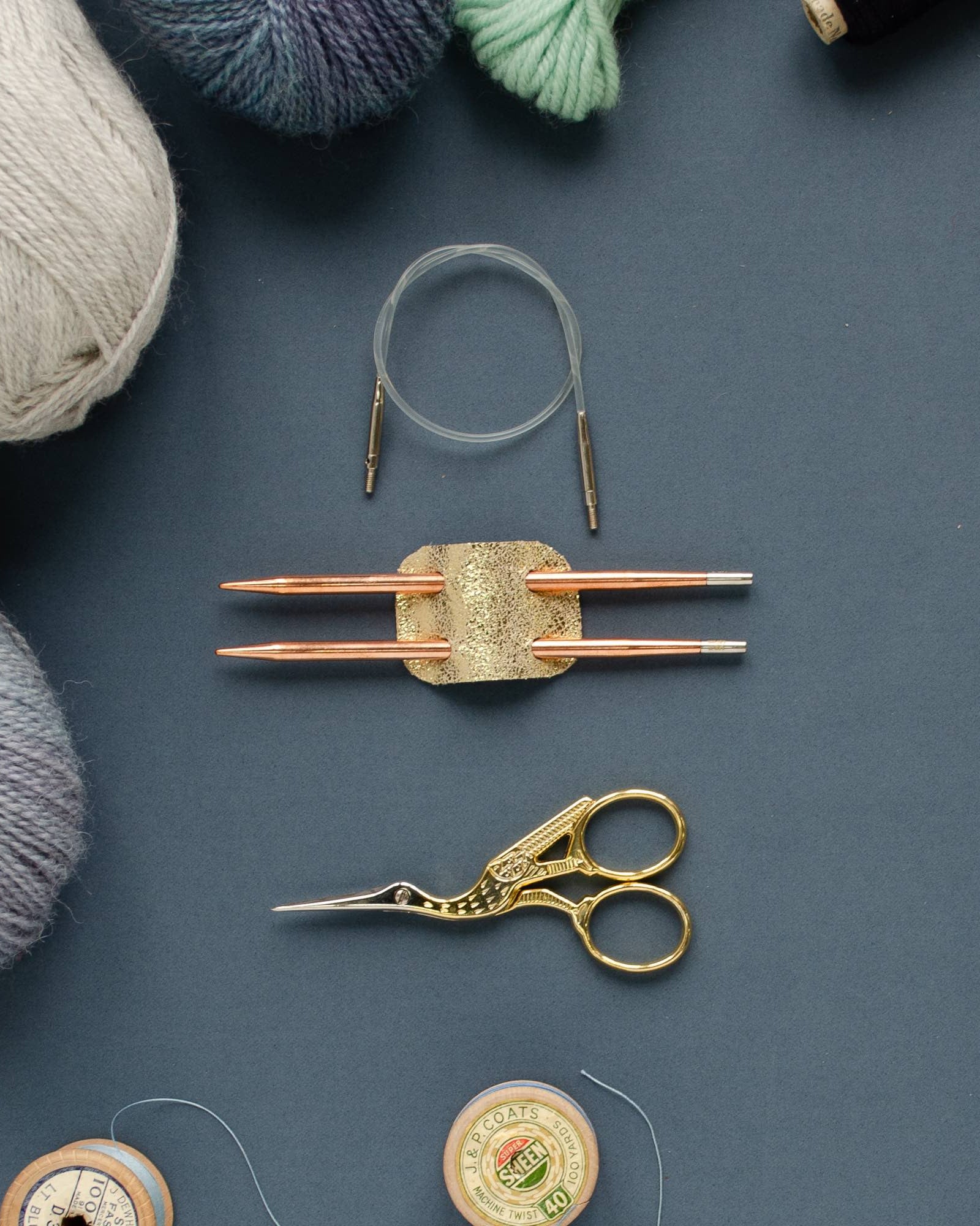 Gold knitting needle holder