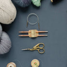 Gold knitting needle holder