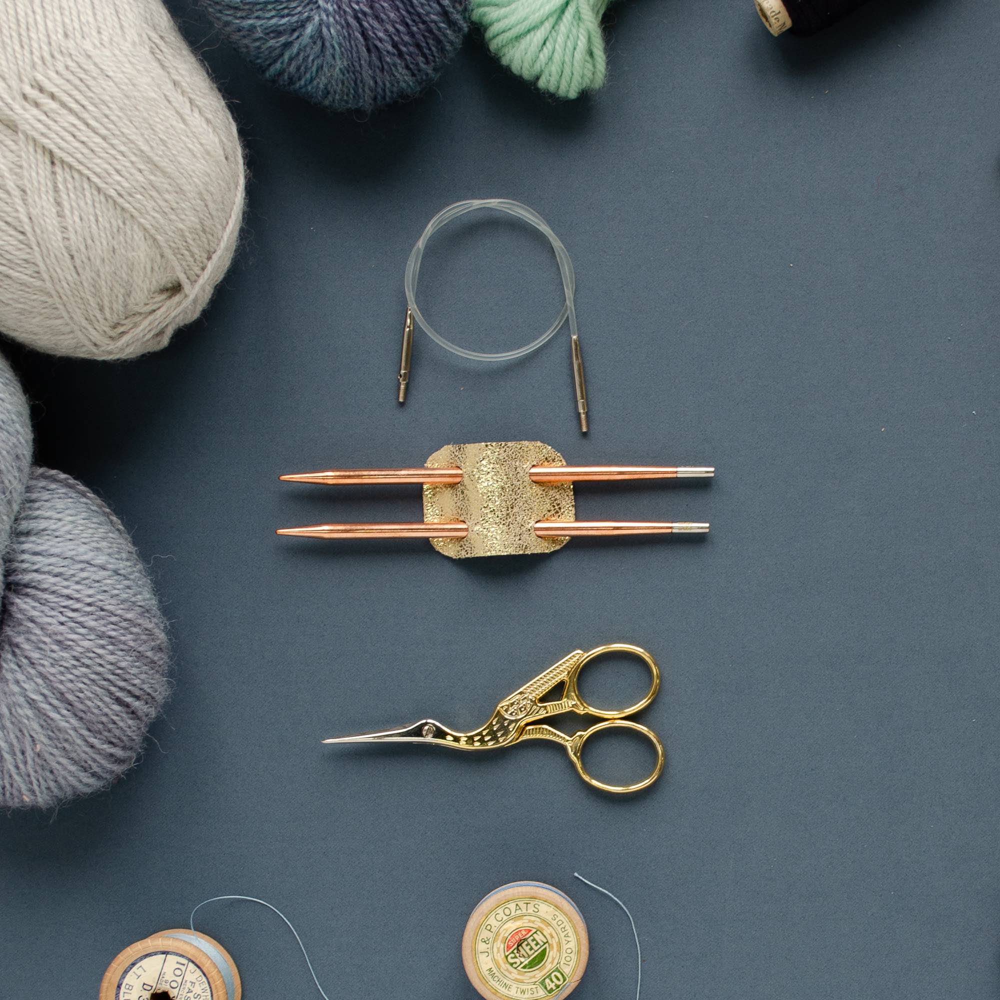 Gold knitting needle holder