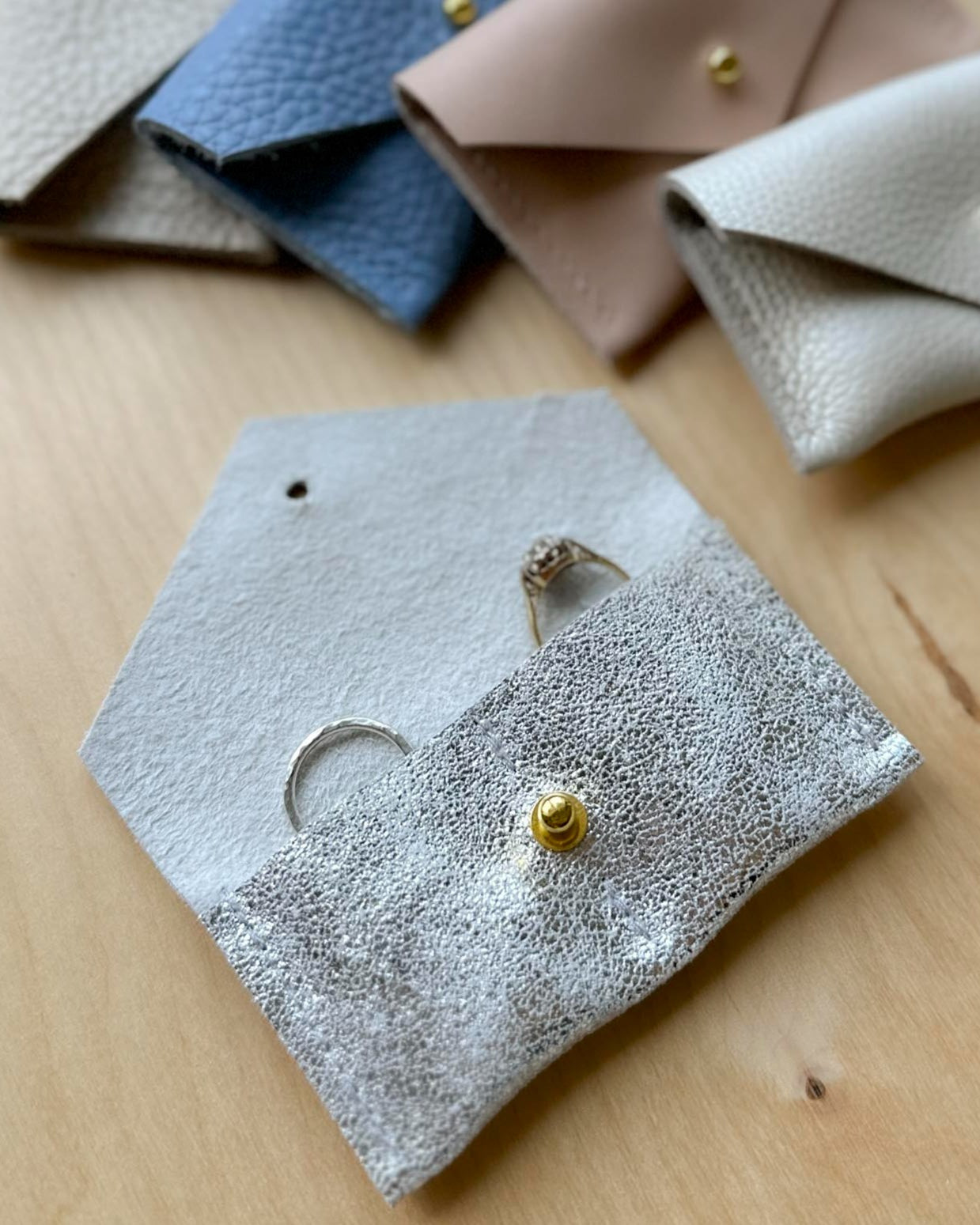 Silver wedding ring pouch, with a pocket for each ring.