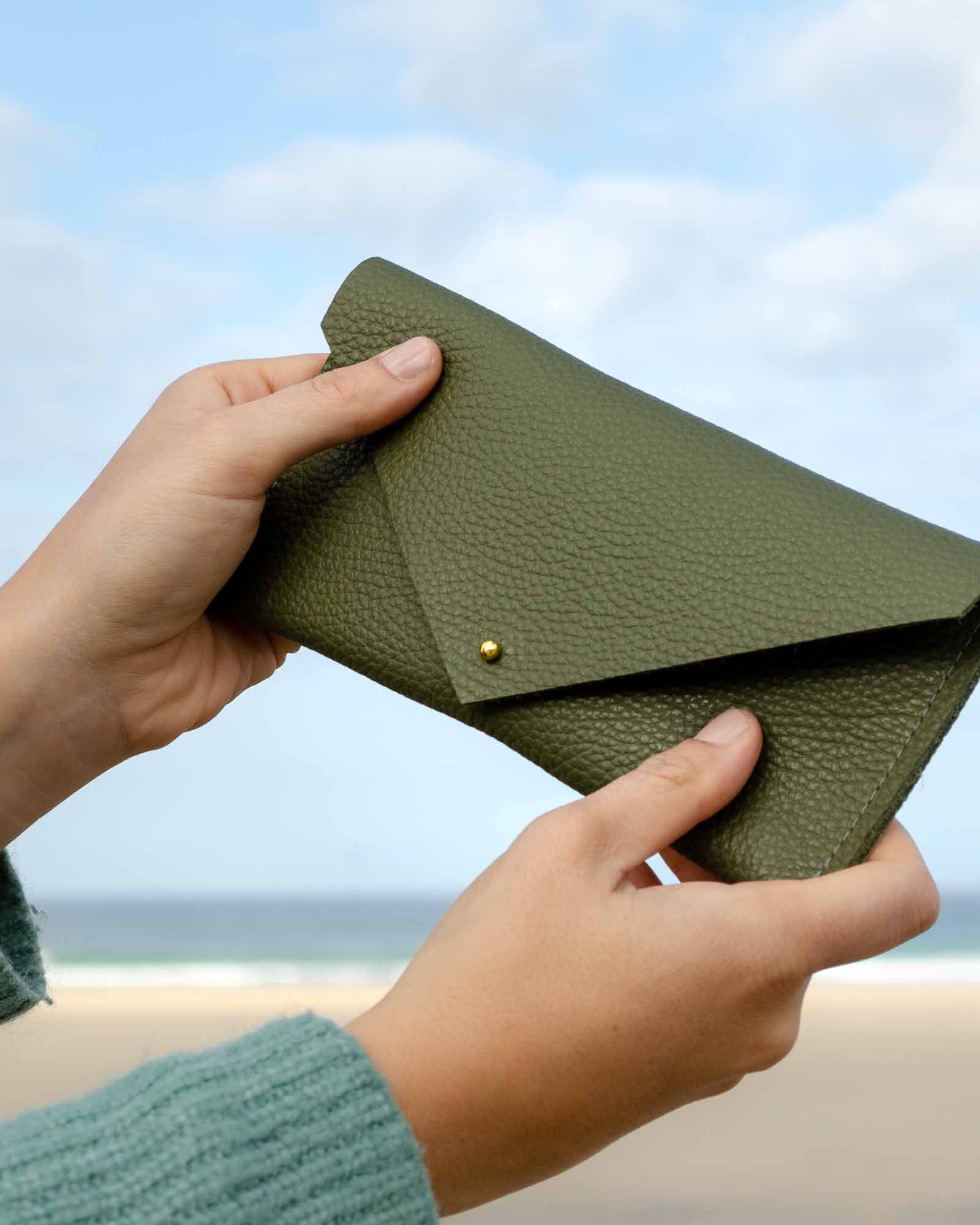 Olive khaki green clutch purse with envelope design.