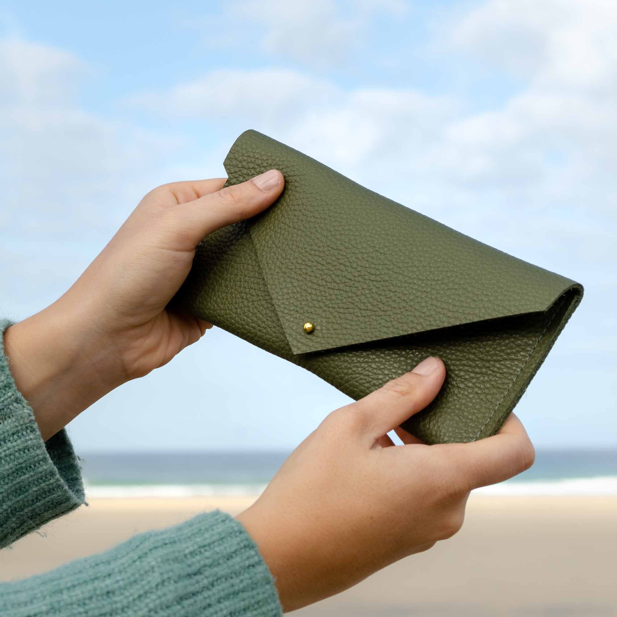 Olive khaki green clutch purse with envelope design.