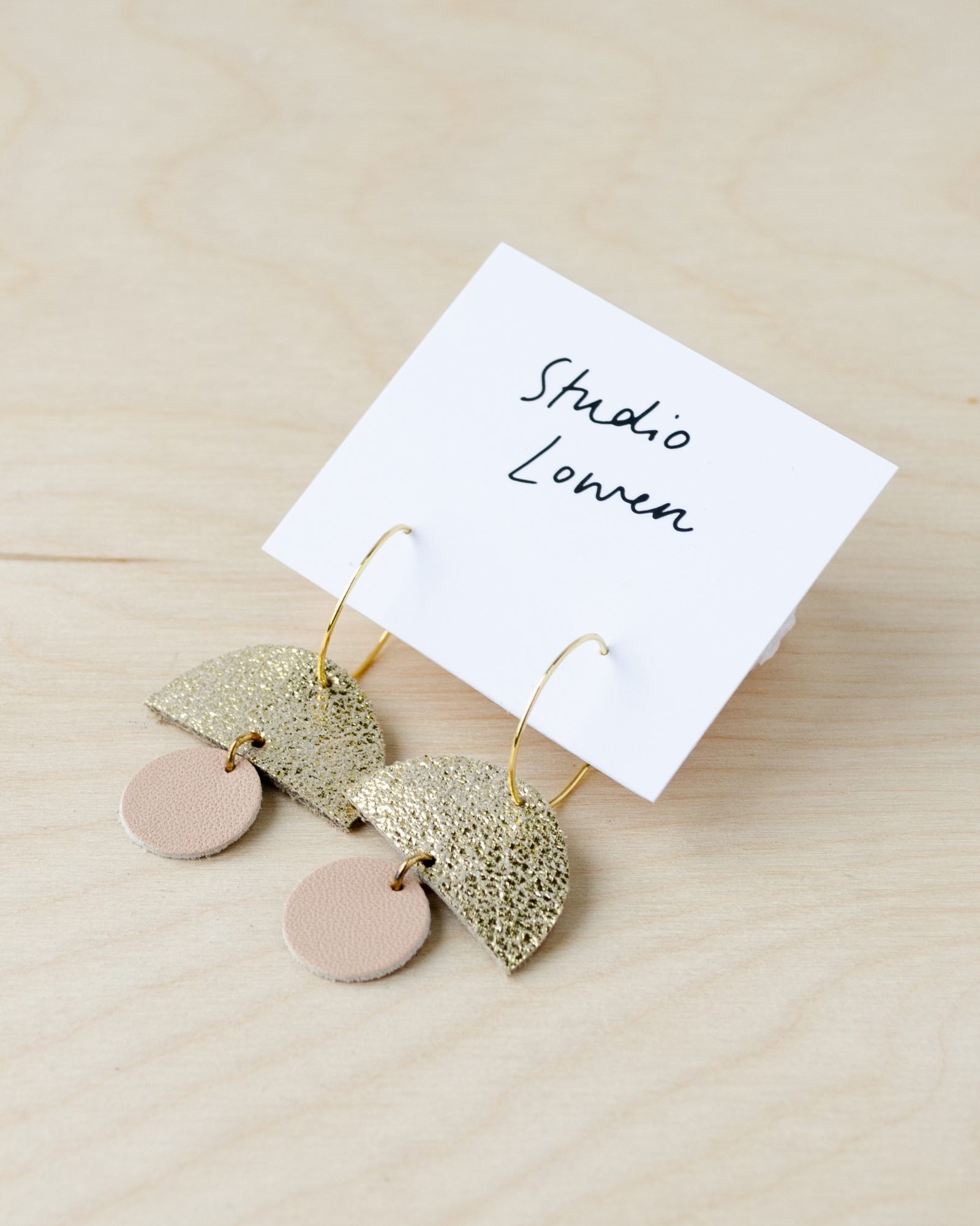 Sunrise hoop earrings in nude leather.