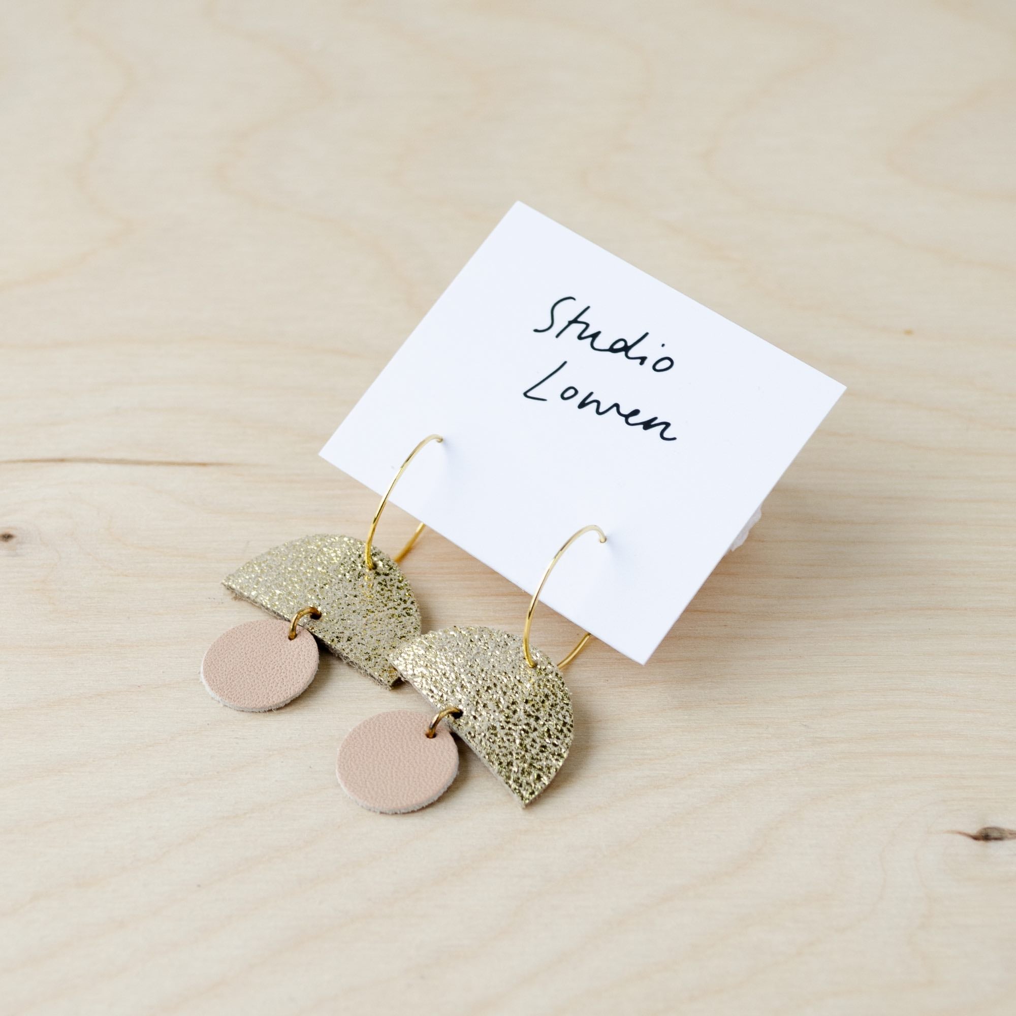 Sunrise hoop earrings in nude leather.