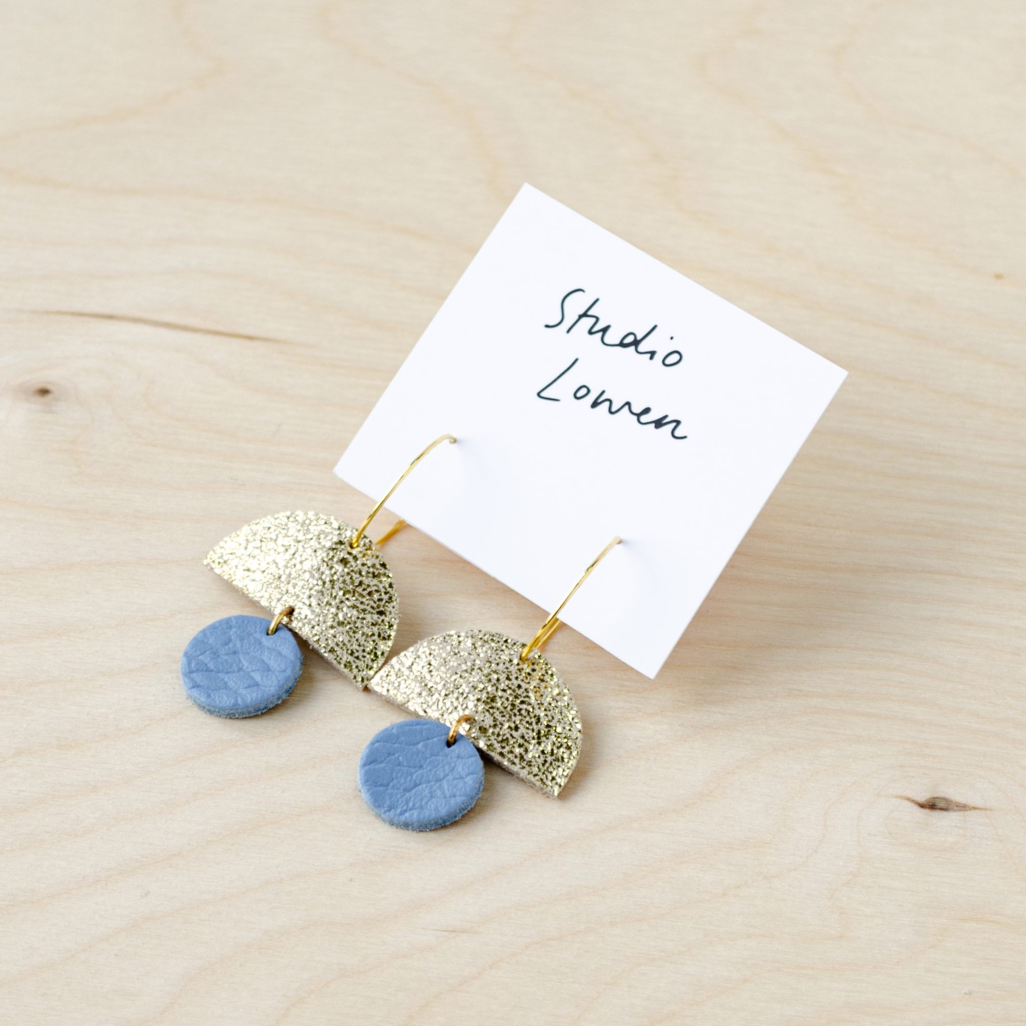 Sunrise hoops in shimmer gold and powder blue leather