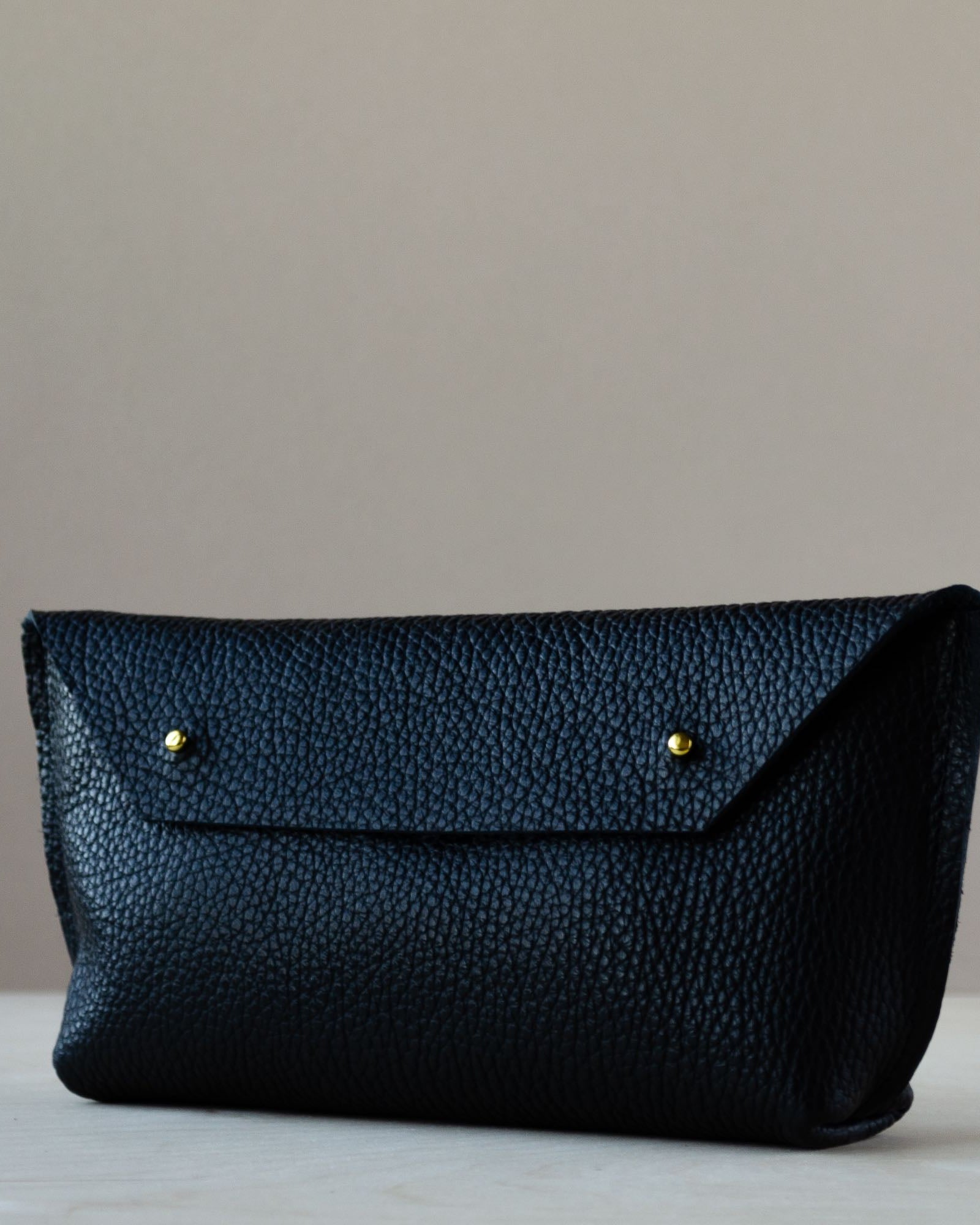 Black Leather Clutch Bag with Gold Fastenings