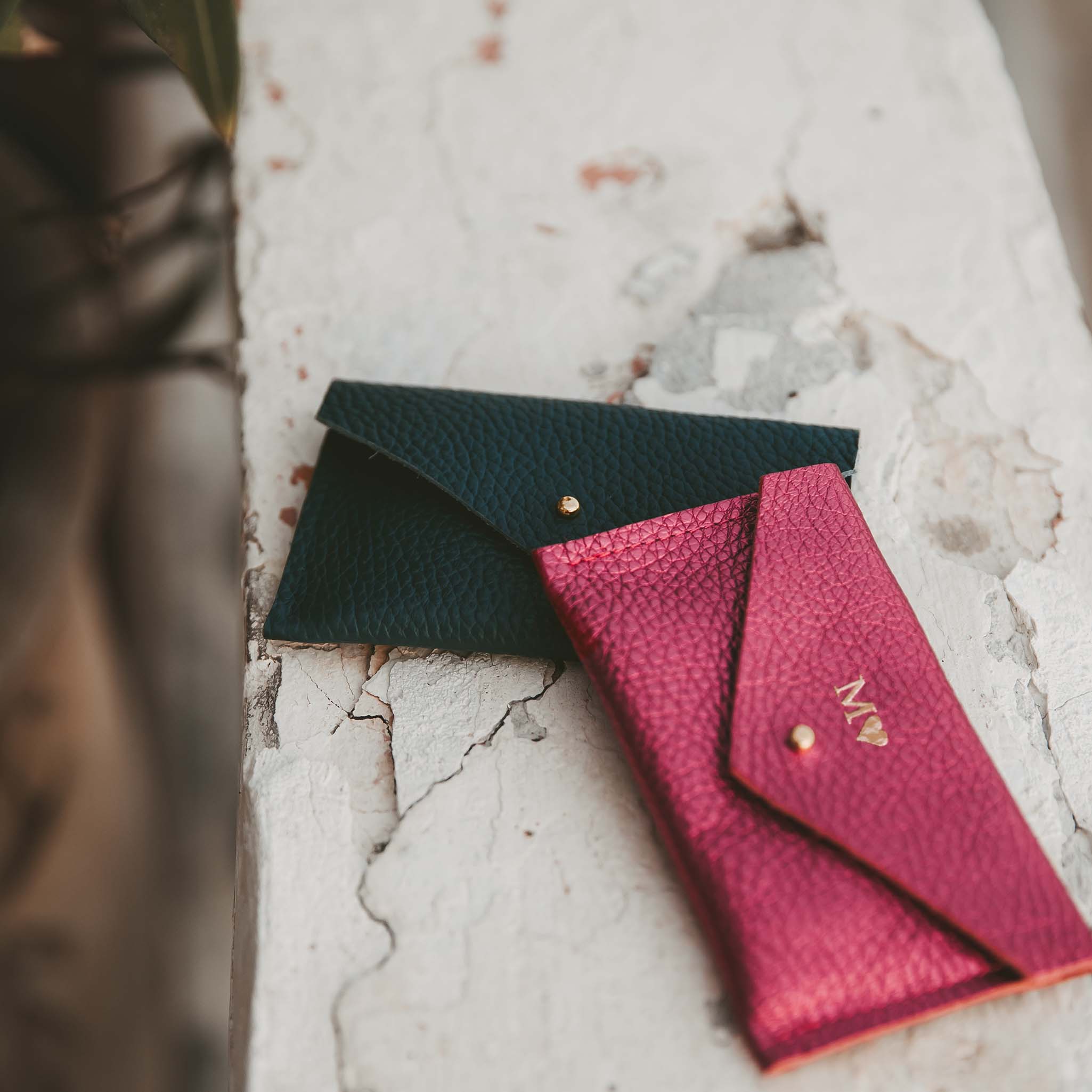 Teal and Pink compact bank card wallet on a white background.