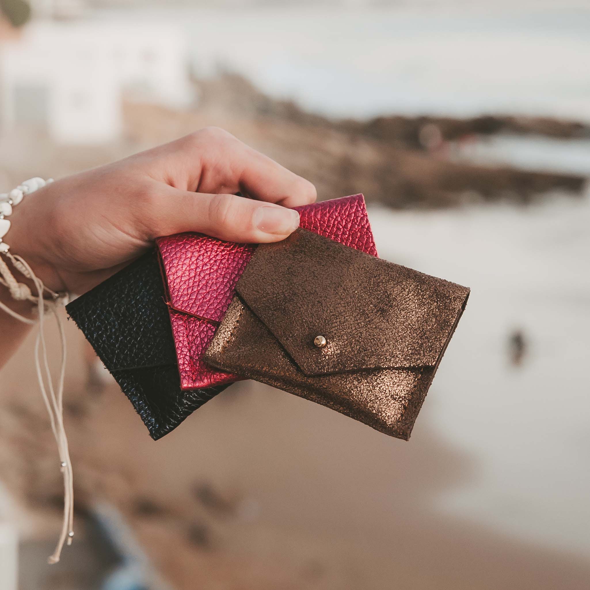 Pink suede personalised jewellery pouch with stacking rings.