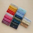 Colourful leather swatches on a plywood board