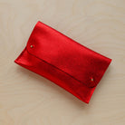 Leather clutch bag in metallic red 